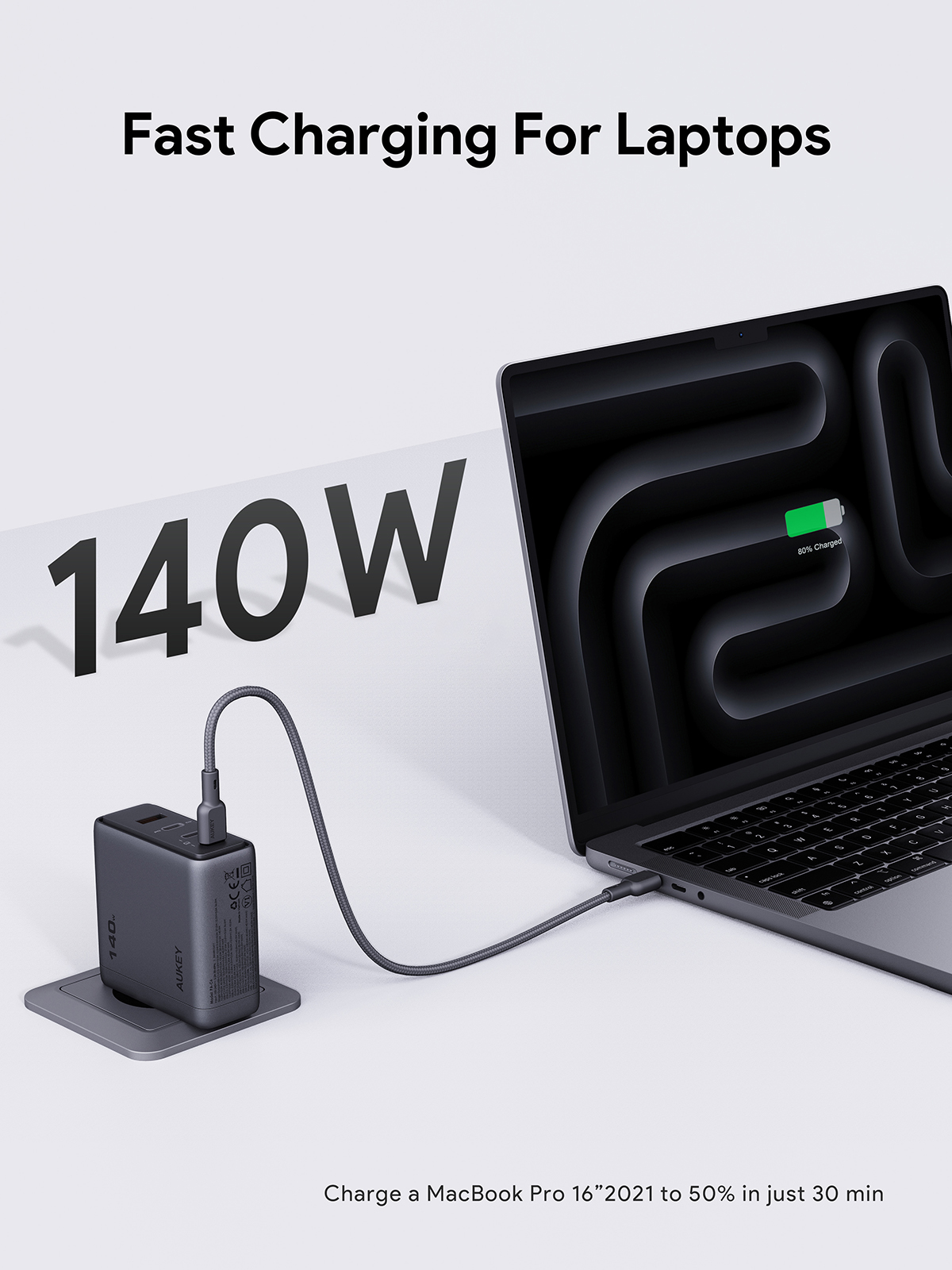 Un portátil se carga con un cargador de 140W. La pantalla del portátil muestra 80% cargado. El texto dice 'Carga rápida para portátiles'.