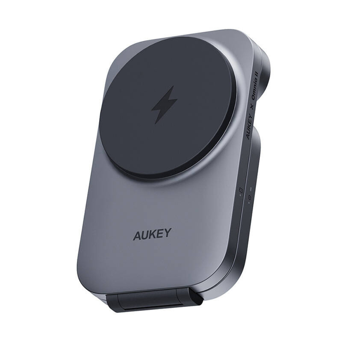 Un cargador inalámbrico AUKEY gris. El cargador tiene una plataforma de carga circular negra con un símbolo de rayo.