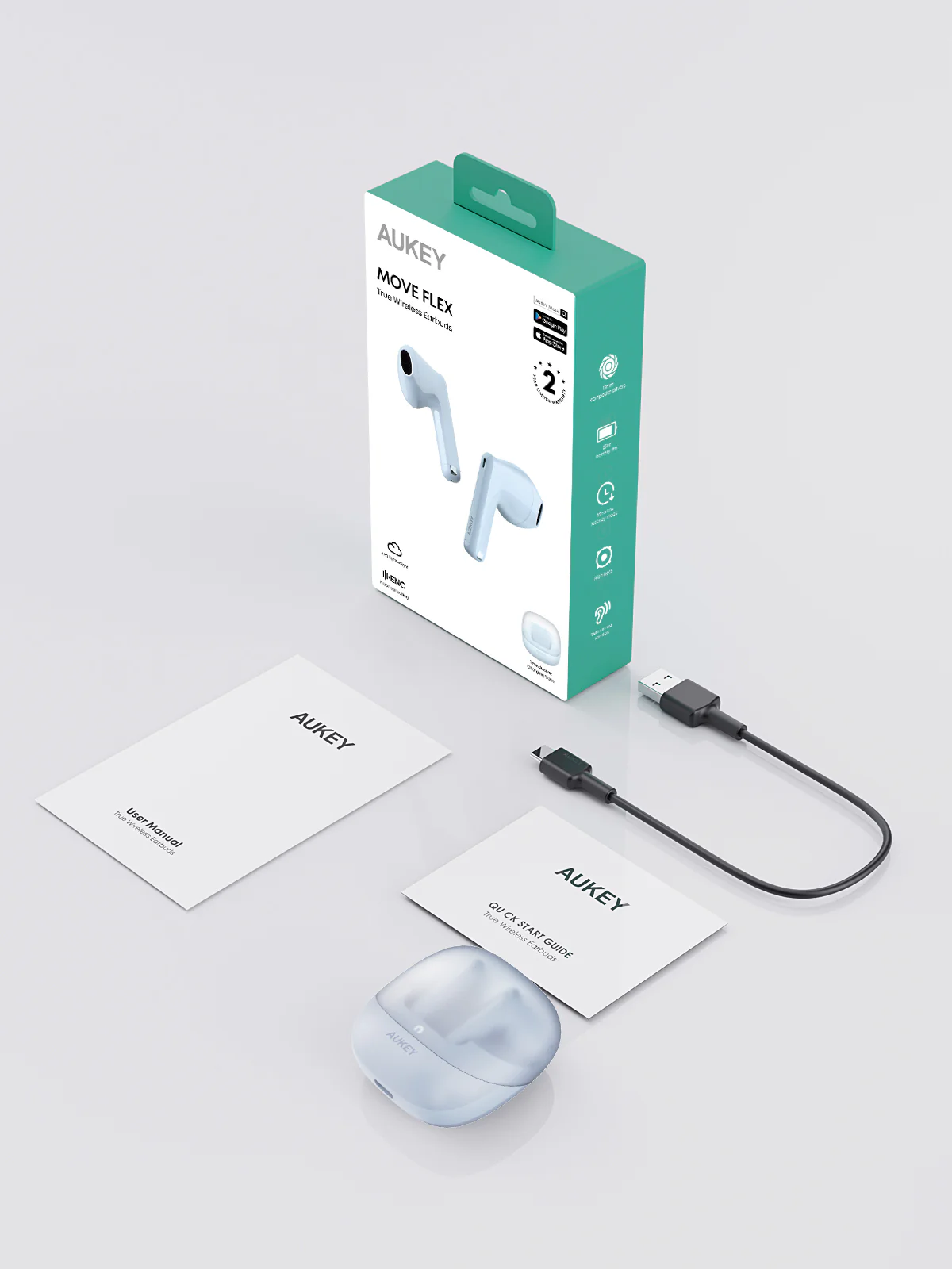 Un conjunto de productos de auriculares AUKEY. Incluye auriculares, estuche de carga, caja, manuales y un cable USB. Todos los elementos están sobre una superficie blanca.