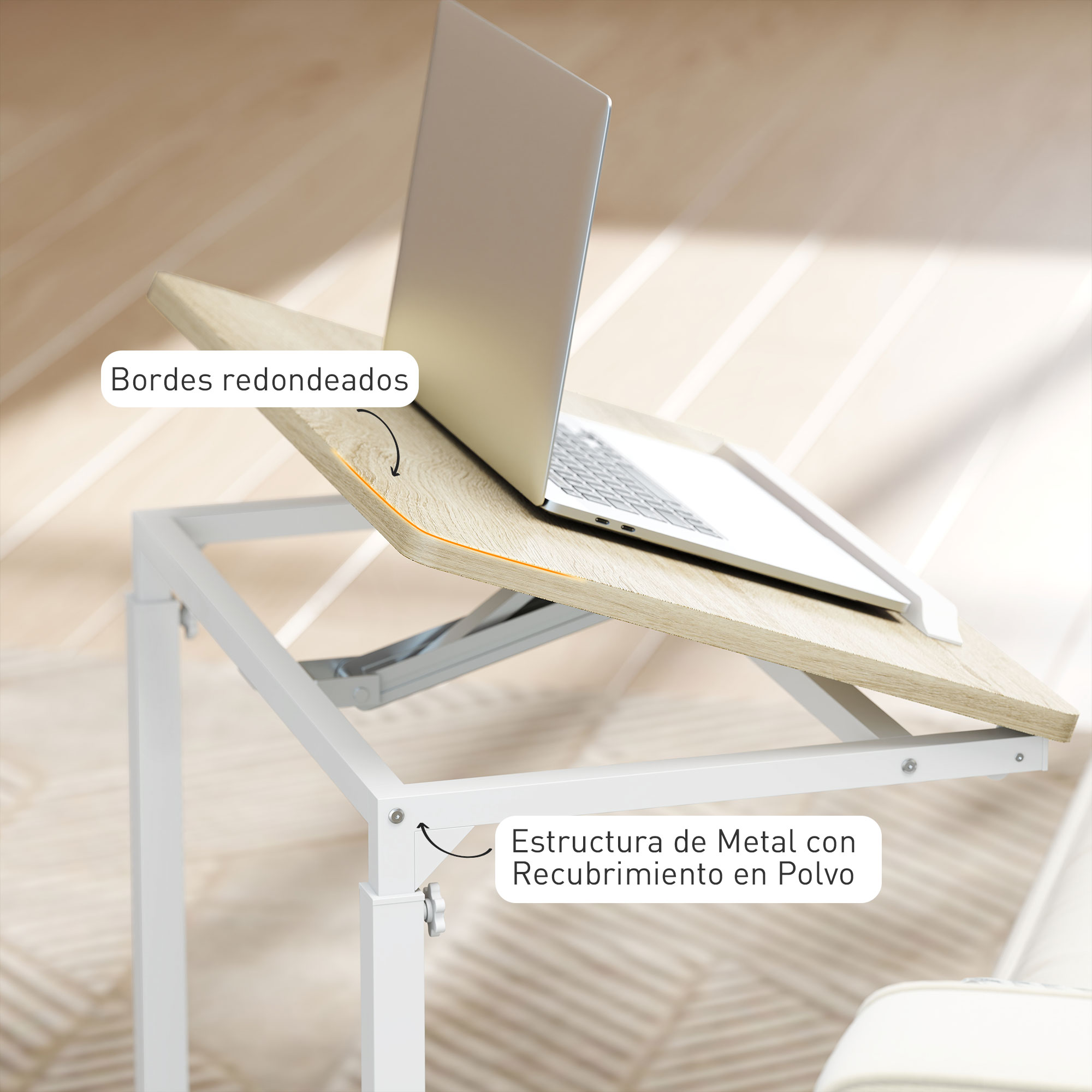 Portátil sobre una mesa de madera, con marco de metal blanco. Bordes redondeados en la mesa. En el fondo, un suelo de madera.