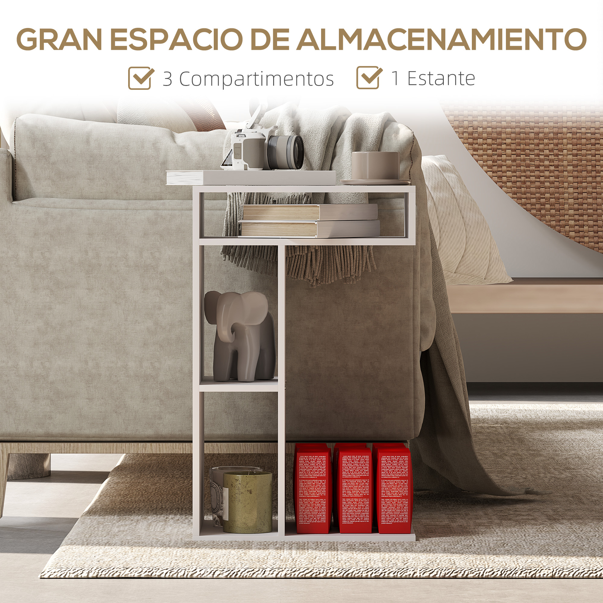Una mesa auxiliar blanca con objetos. Hay tres cajas rojas en la parte inferior. Se ven una estatua de elefante gris y libros.