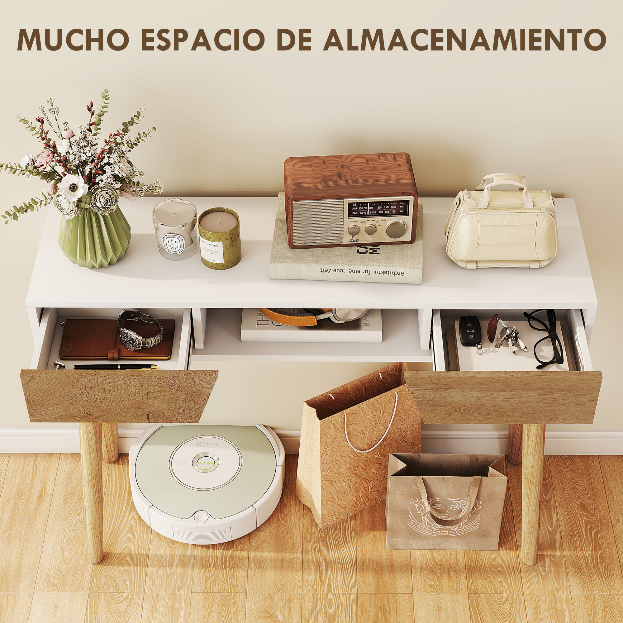 Una mesa de almacenamiento blanca con cajones, radio, flores, velas y bolsas de compras. Un robot aspirador está en el suelo.