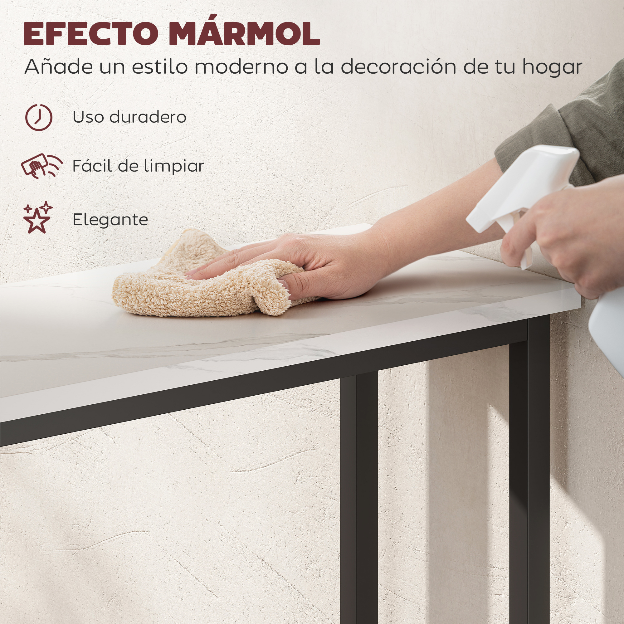 Una persona limpia una mesa de mármol blanco con un paño beige y un pulverizador. Patas metálicas negras la sostienen.