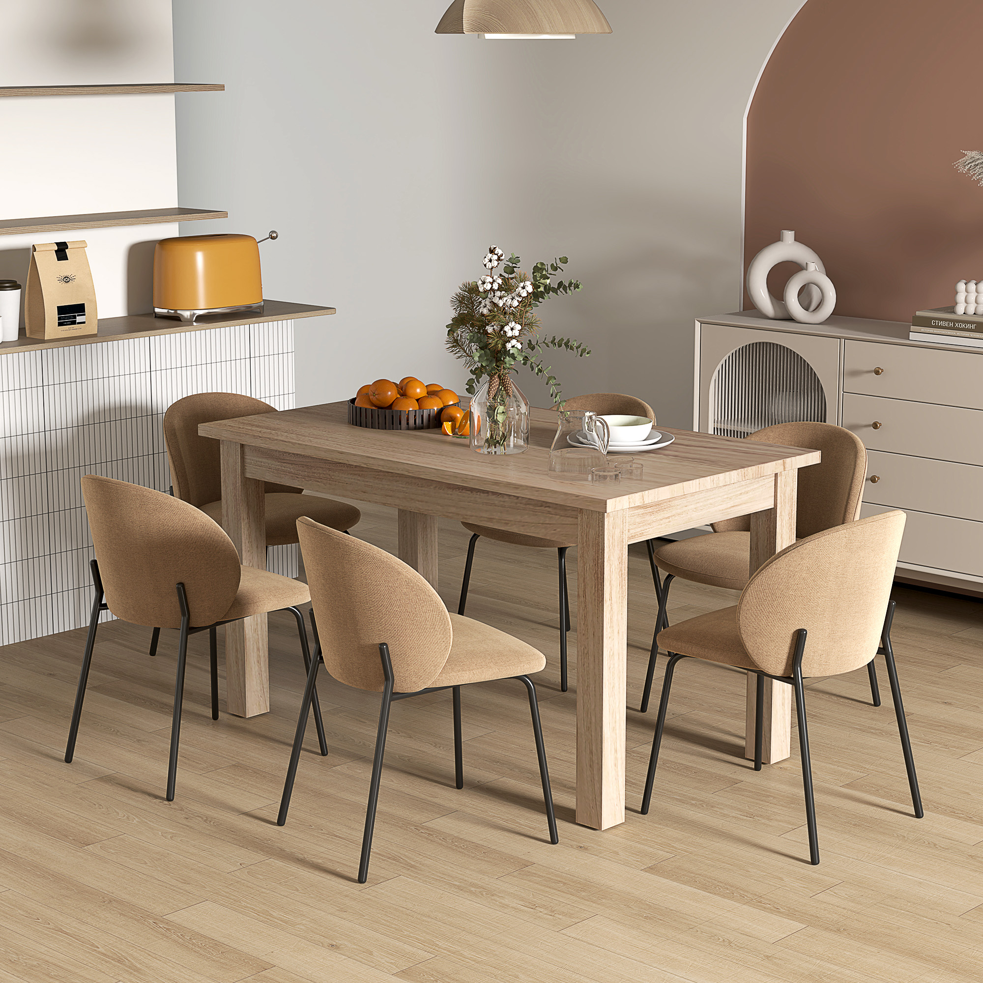 Un comedor con mesa de madera, sillas, naranjas y una tostadora. Los tonos neutros dominan la escena.
