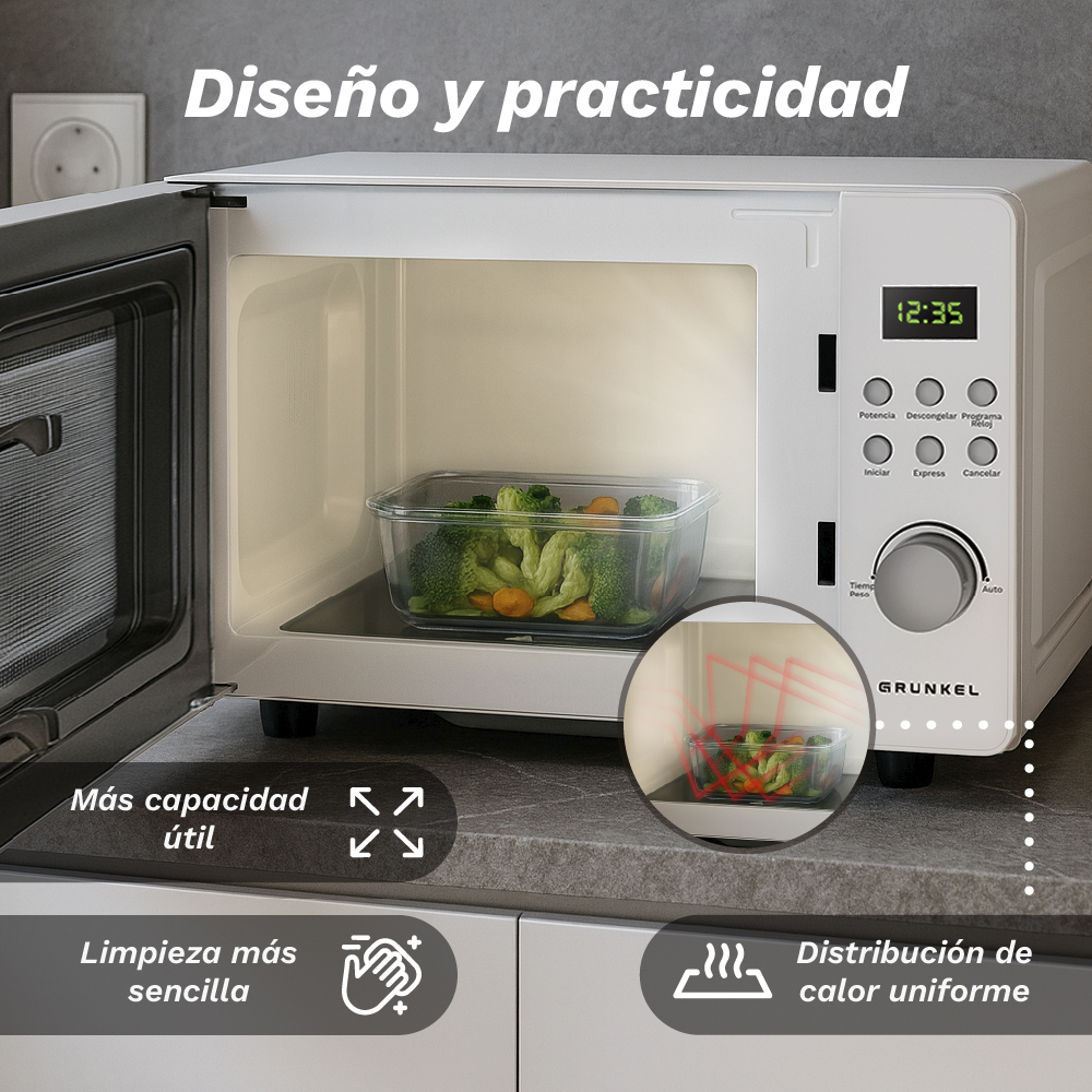 Un forno a microonde bianco con un contenitore di broccoli e carote all'interno. L'ora è 12:35. Ha dei pulsanti di controllo.