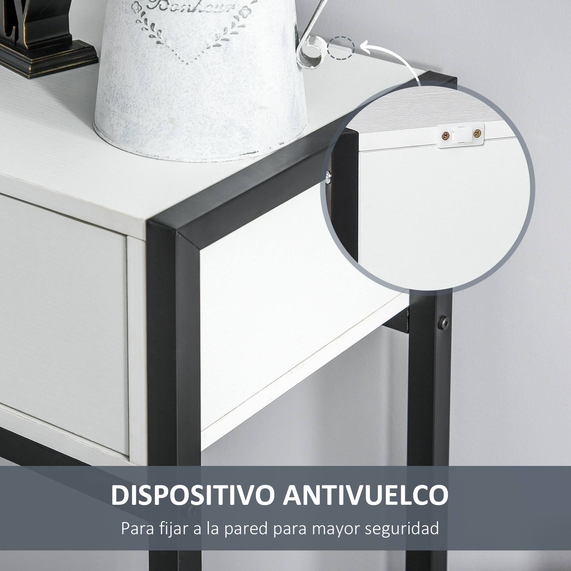 Mesa auxiliar blanca y negra con cajón. Una cubeta metálica blanca con diseño floral en la parte superior.