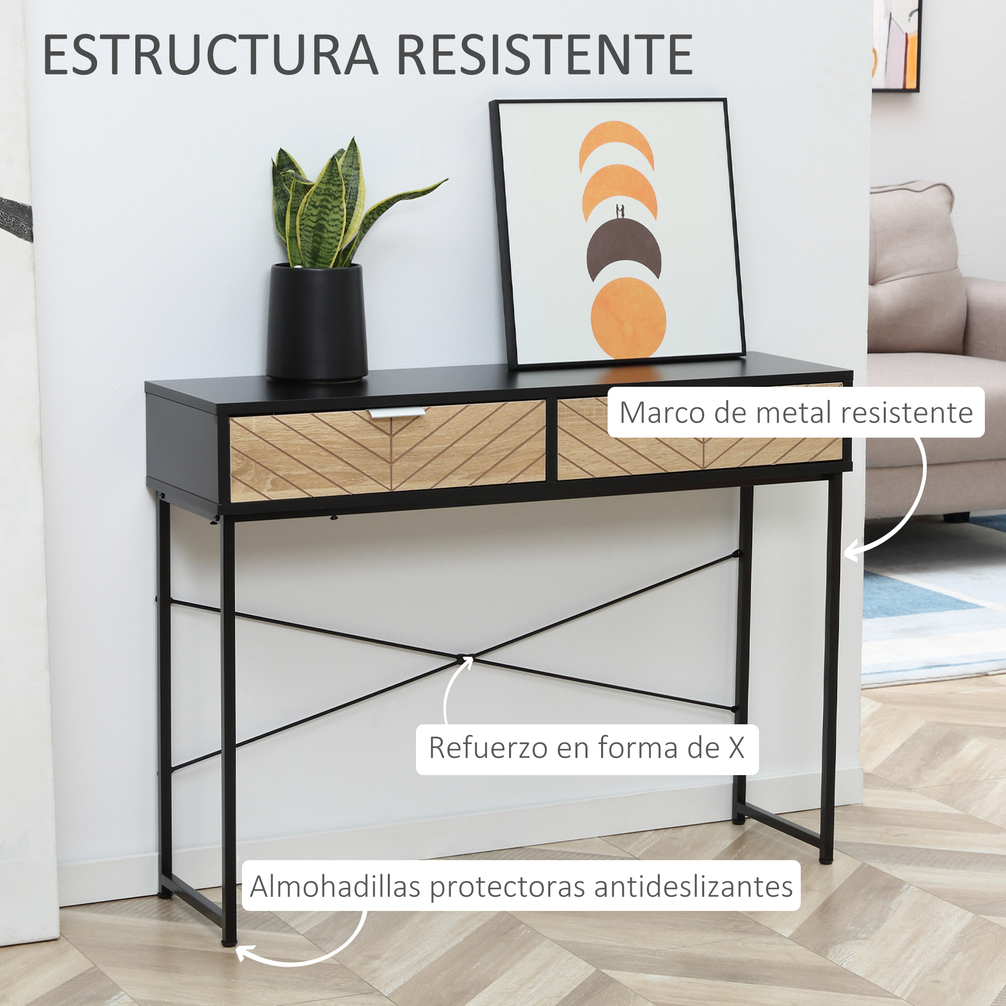 Una consola negra y de madera con un cuadro enmarcado, una planta y un sofá beige al fondo.