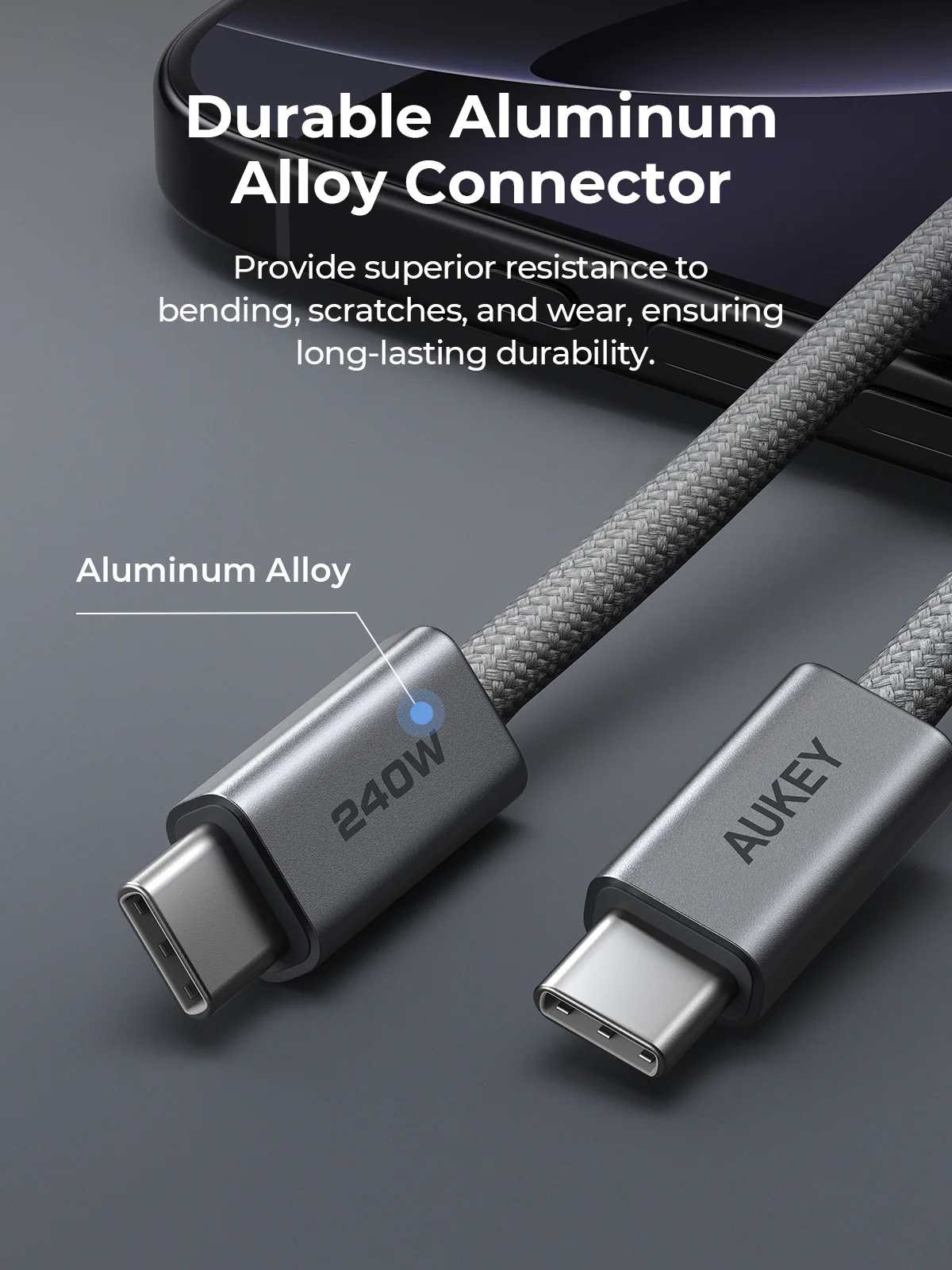 Un cable USB-C gris con conectores de aleación de aluminio. El cable tiene una textura trenzada. Texto: Conector de aleación de aluminio duradero.