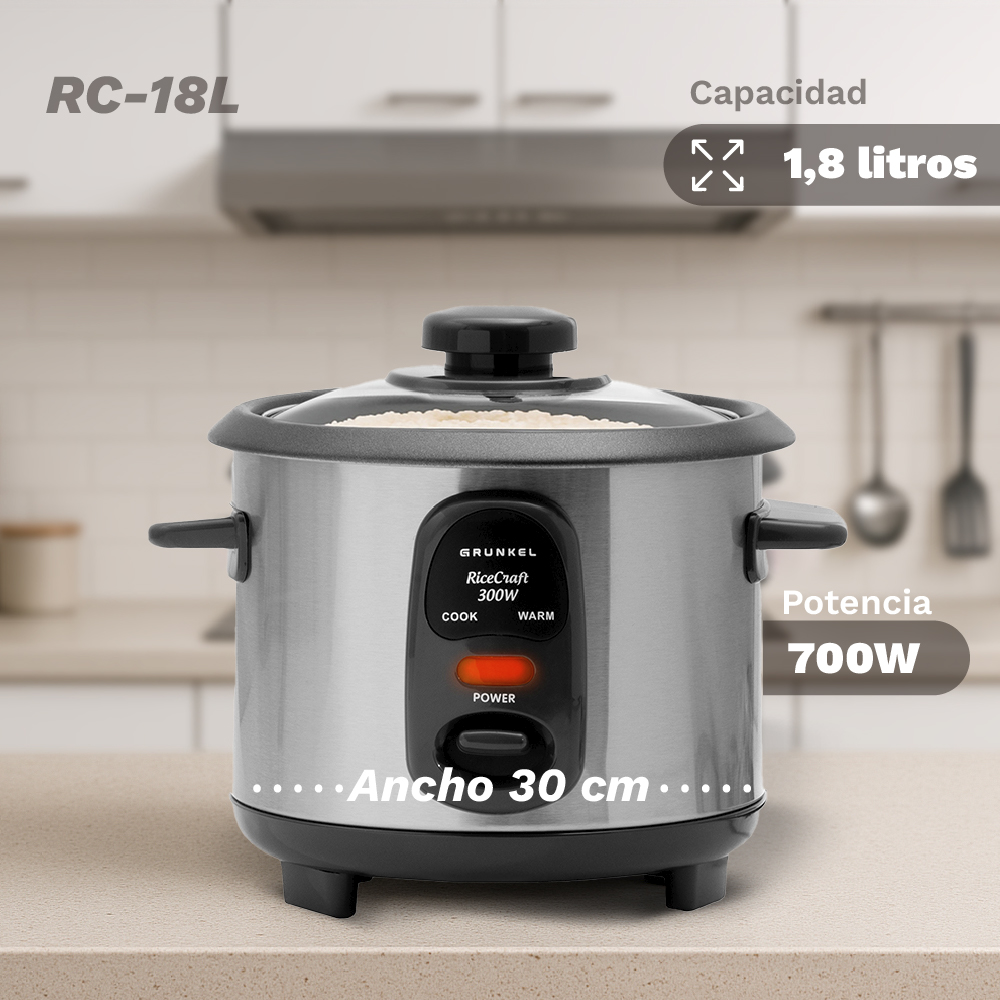 Una arrocera plateada y negra, modelo RC-18L, con capacidad de 1,8 litros y potencia de 700W, sobre una encimera de cocina.