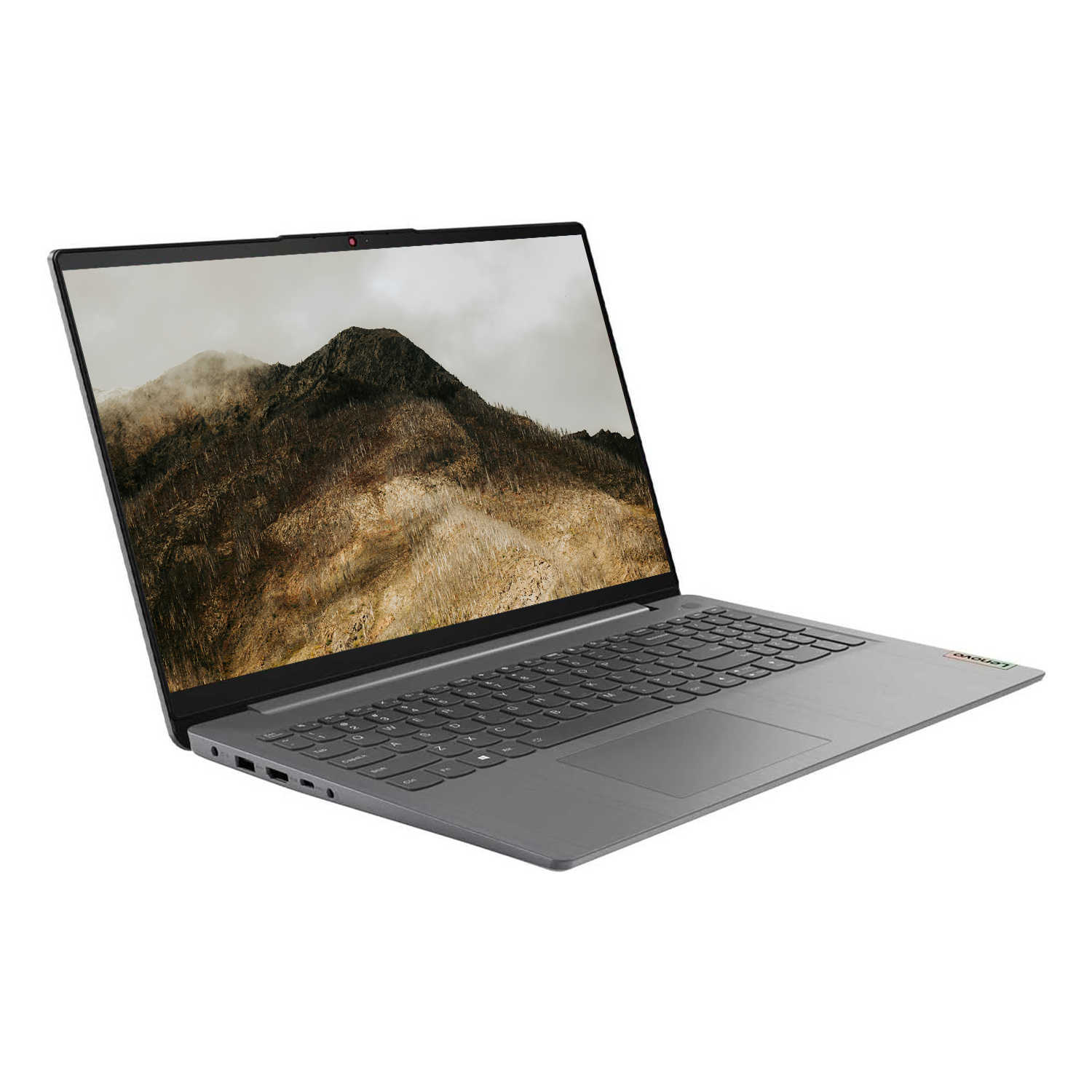 Gri bir Lenovo dizüstü bilgisayar açık, dağ manzarasını gösteriyor. Beyaz zemin üzerinde klavye ve dokunmatik yüzey görünür.