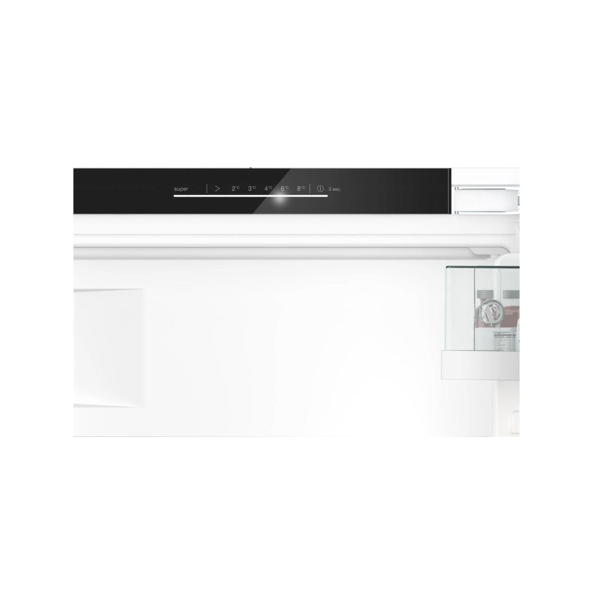 A refrigerator control panel with temperature settings and a 'super' function is displayed. The door is open, showing the interior.