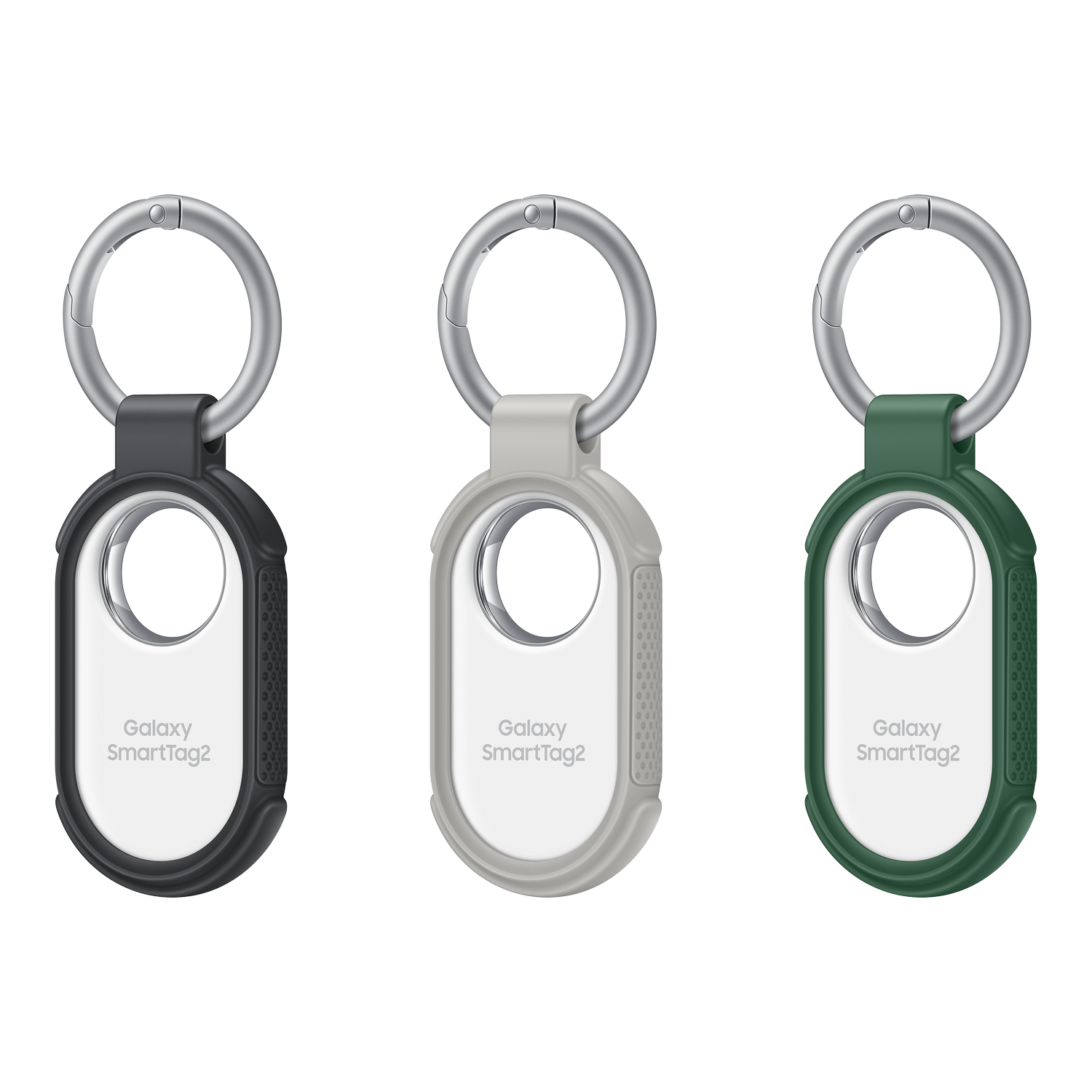 Tre tracker Galaxy SmartTag2. A sinistra: nero. Centro: grigio. A destra: verde. Ognuno ha un anello argentato e un portachiavi.