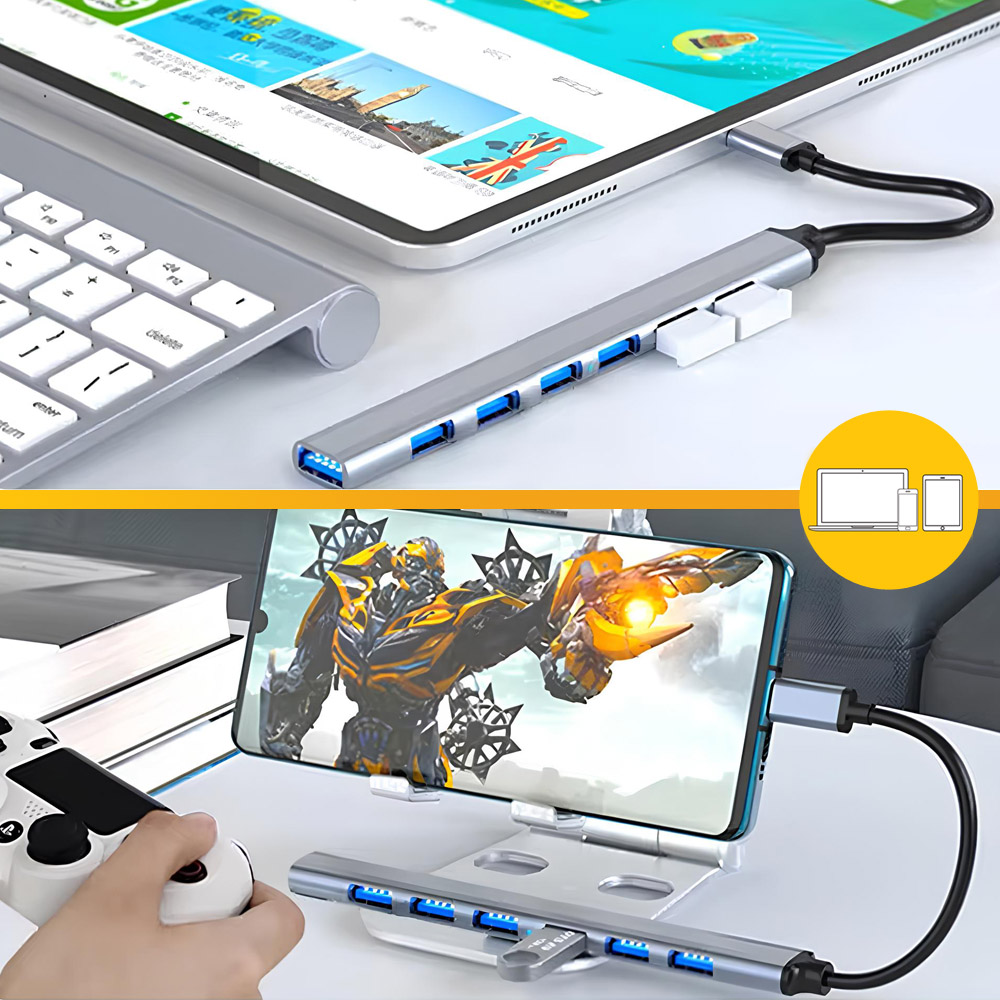 Tablet i smartfon podłączone do huba. Smartfon wyświetla postać robota. Widoczna jest klawiatura i kontroler do gier.