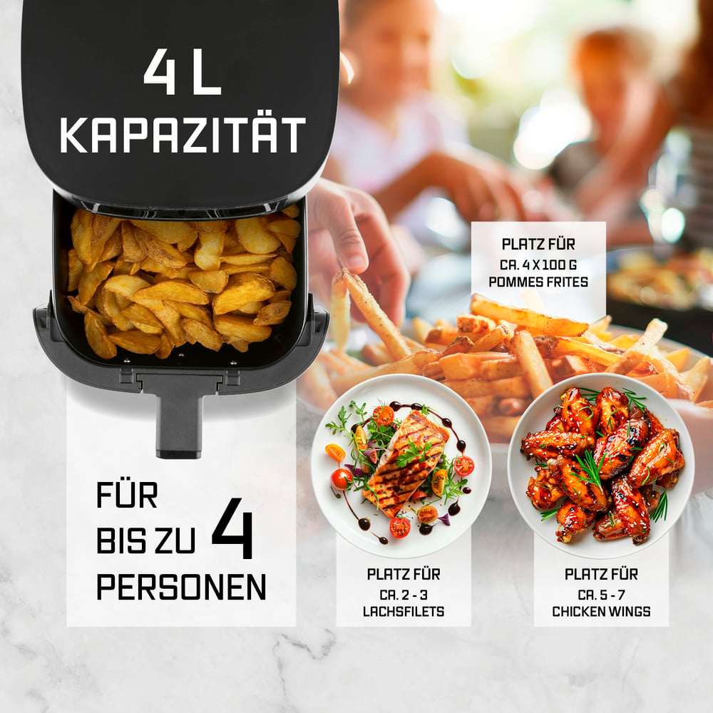 Eine Heißluftfritteuse mit Pommes Frites, Lachs, Hähnchenflügeln und Pommes Frites. Text für 4 Personen.