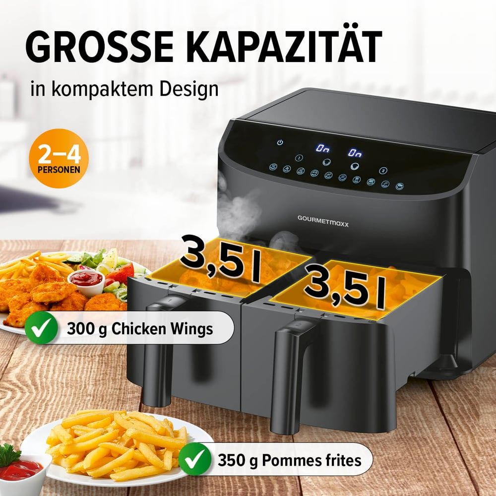 Schwarze Heißluftfritteuse mit zwei Körben, Text: GROSSE KAPAZITÄT, 300g Hähnchenflügel, 350g Pommes. Dampf kommt aus der Fritteuse.
