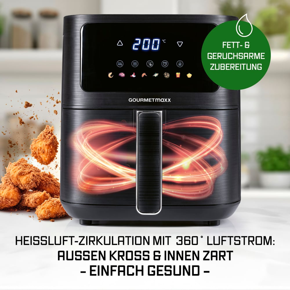 Ein Airfryer mit digitaler Anzeige von 200°C. Gebratenes Essen im Vordergrund, grüner Kreis mit 'fettarm kochen'.