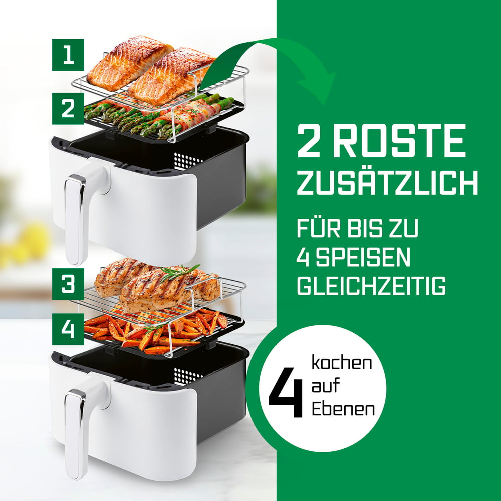Eine Heißluftfritteuse mit Speisen auf Rosten. Lachs, Spargel, Hähnchen und Karotten werden mit grünem Hintergrund und Text angezeigt.