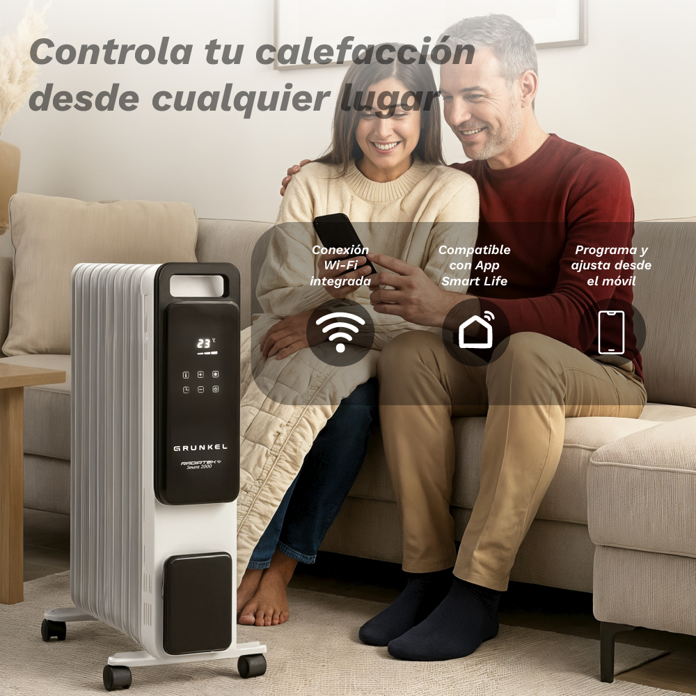 Una pareja está sentada cerca de un calefactor. El calefactor tiene una pantalla digital que muestra 23 grados. El texto superior dice 'Controla tu calefacción desde cualquier lugar'.