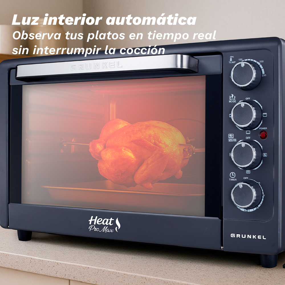Un forno grigio scuro con pollo arrosto all'interno. Ha manopole di controllo e un logo 'Heat Pro Max'.