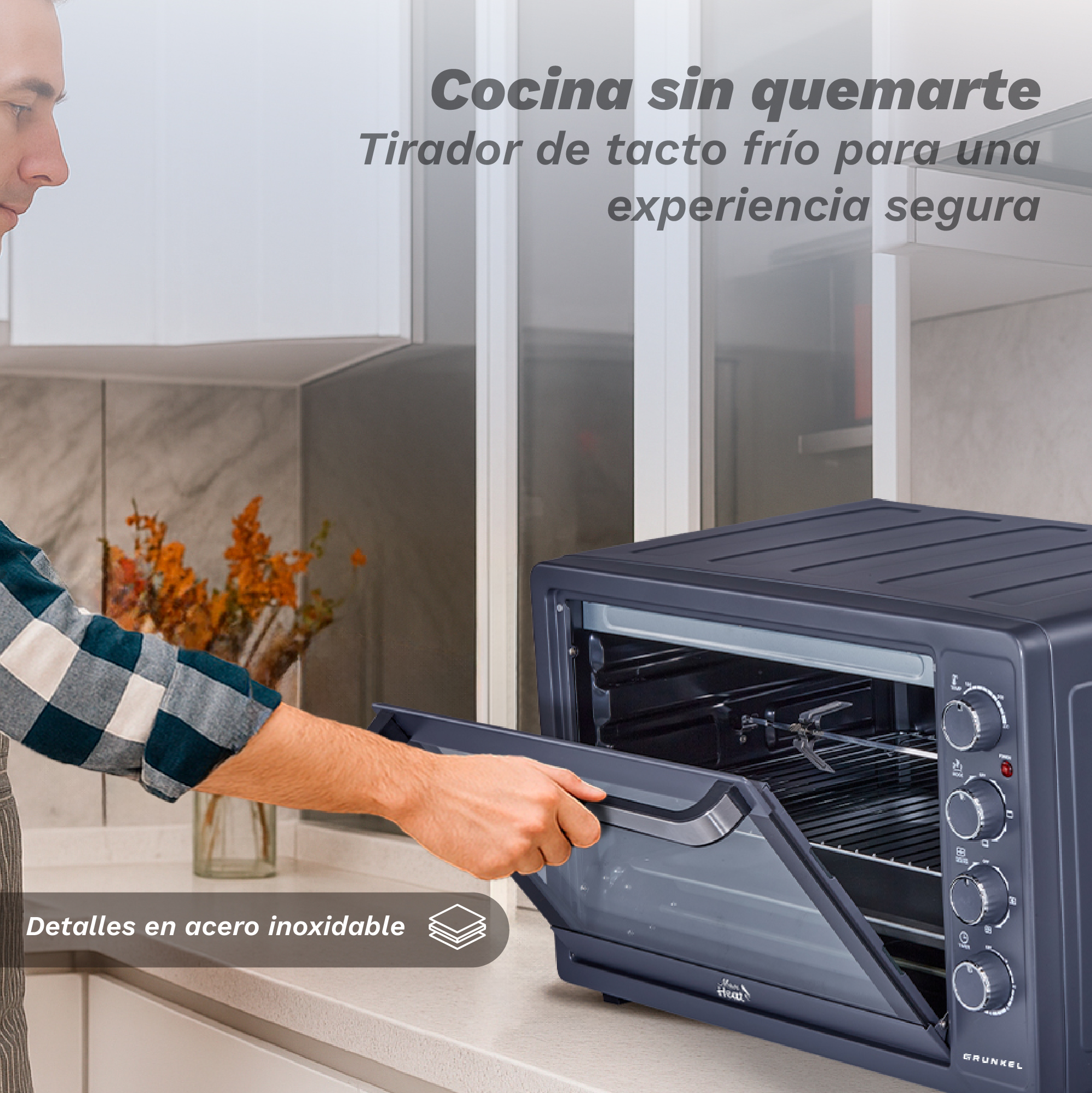 Un hombre abre un horno negro. El texto dice 'detalles de acero inoxidable'. Flores naranjas en un jarrón están en el fondo.