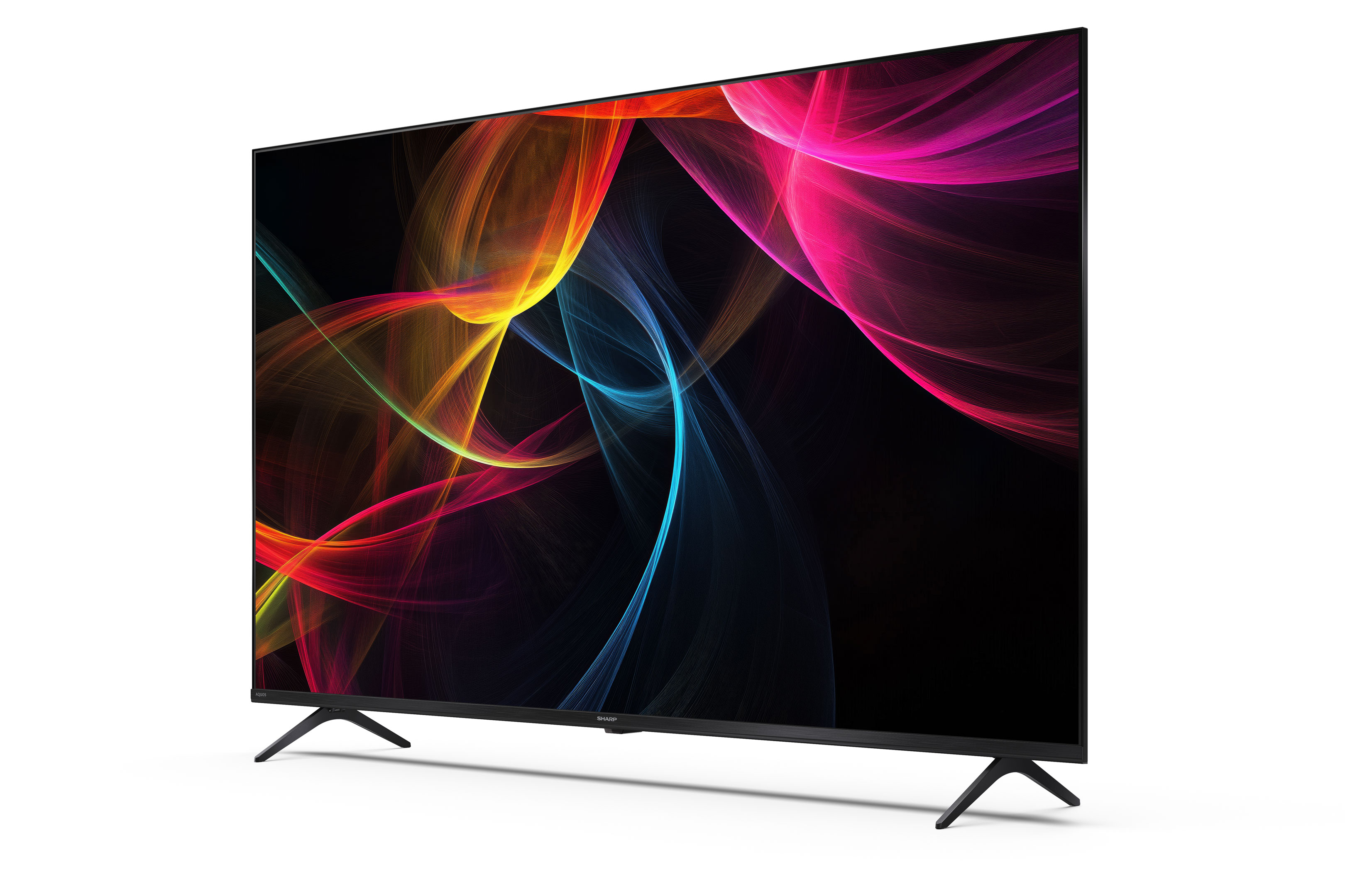 Een Sharp TV toont kleurrijke abstracte kunst tegen een zwarte achtergrond. De tv staat op een wit oppervlak.