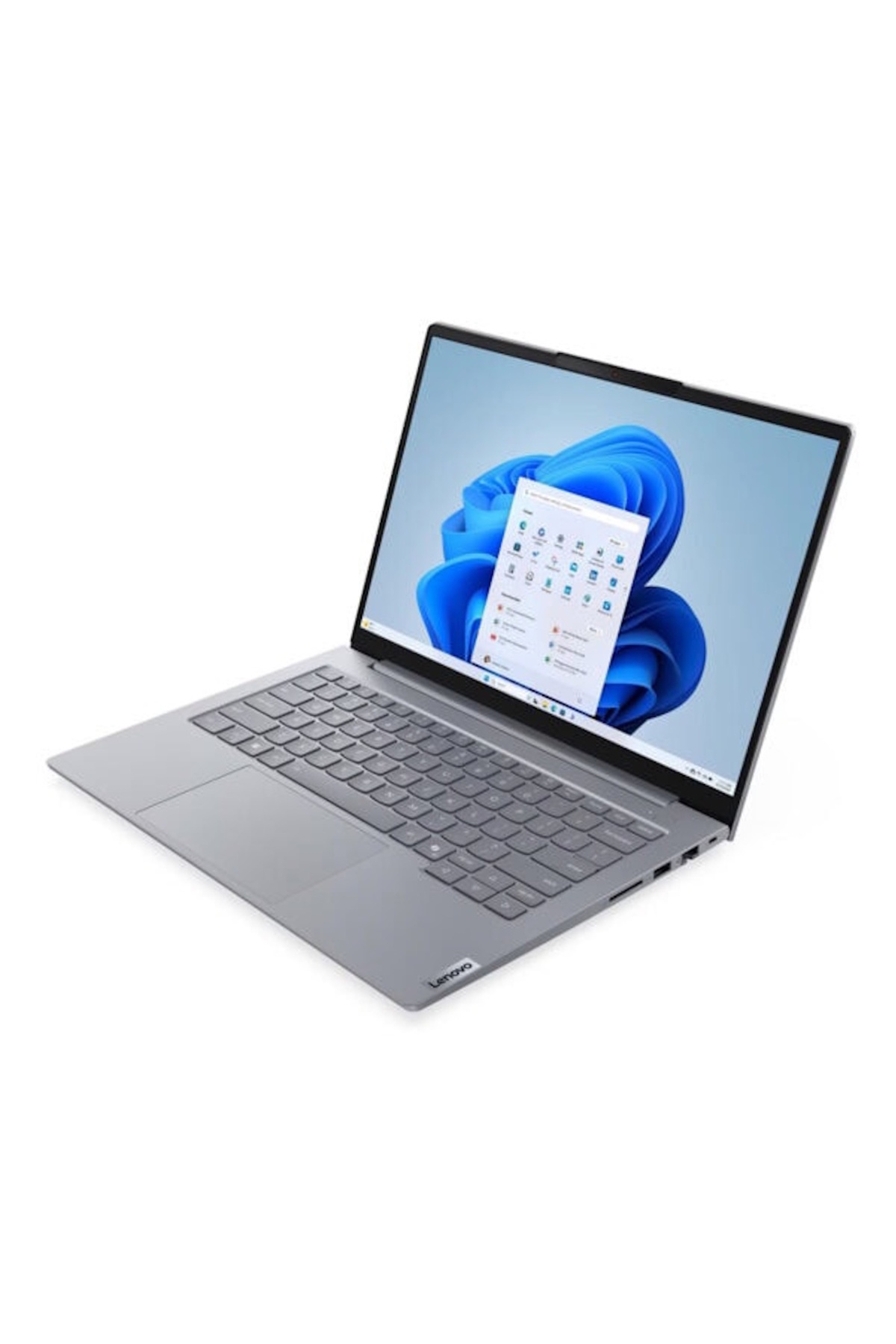 Gri bir Lenovo dizüstü bilgisayar açık, Windows 11 arayüzünü gösteriyor. Ekran uygulama simgelerini gösteriyor. Arka plan beyaz.