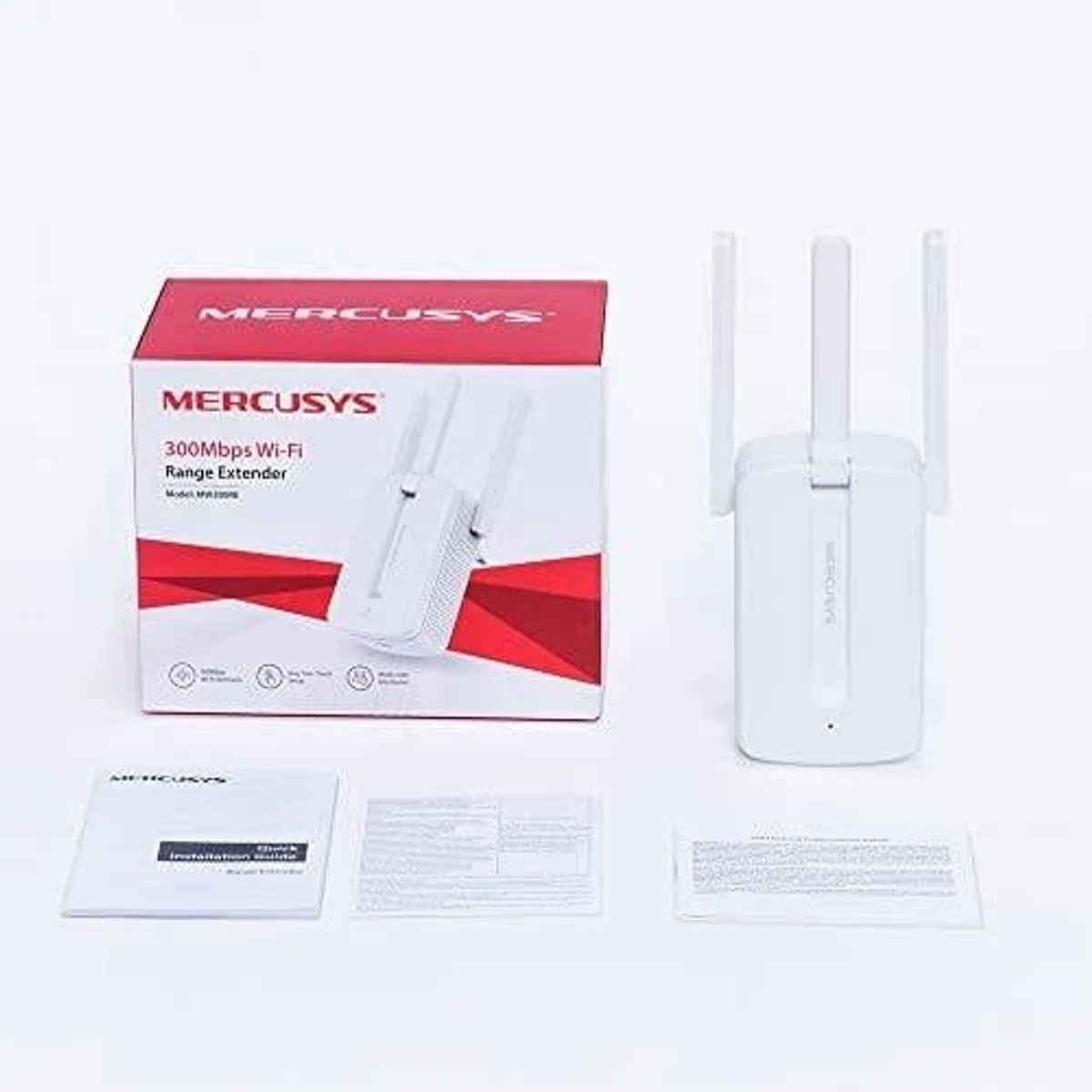 Un extensor de rango Wi-Fi Mercusys blanco, caja y manuales sobre una superficie blanca. La caja dice Extensor de Rango Wi-Fi 300Mbps.