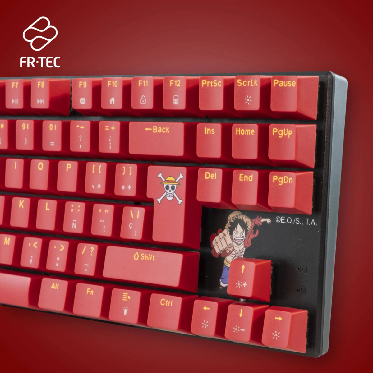 Un teclado rojo con letras blancas. Tiene un tema de One Piece con Luffy en la barra espaciadora y una Jolly Roger.