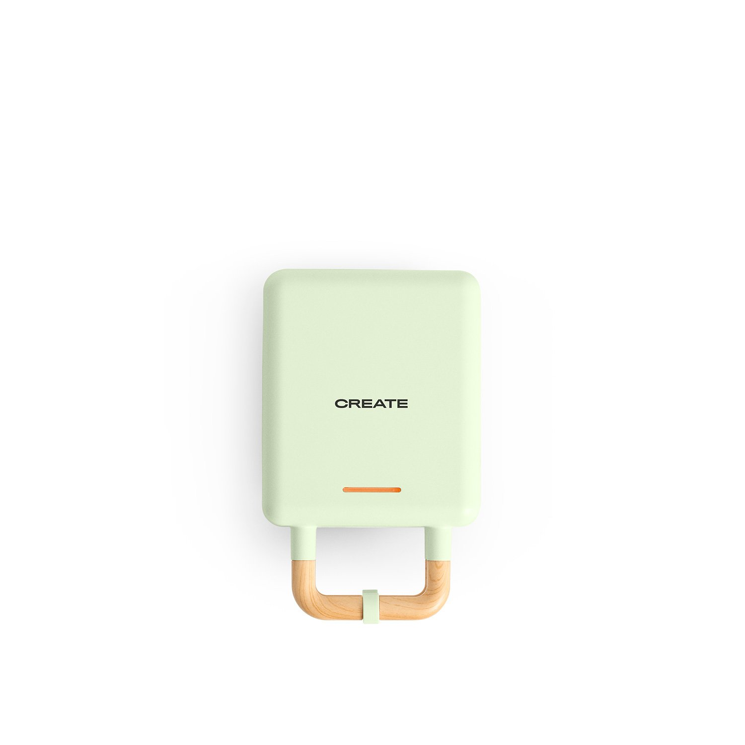 Una gofrera CREATE verde menta con mango de madera. Luz naranja encendida. Fondo blanco.