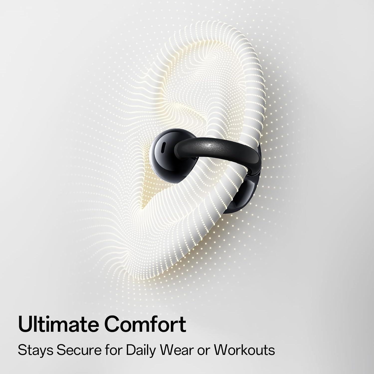 Un auricolare nero con un supporto curvo è posto su un'illustrazione di orecchio bianco punteggiato, il testo 'Ultimate Comfort' è sotto.