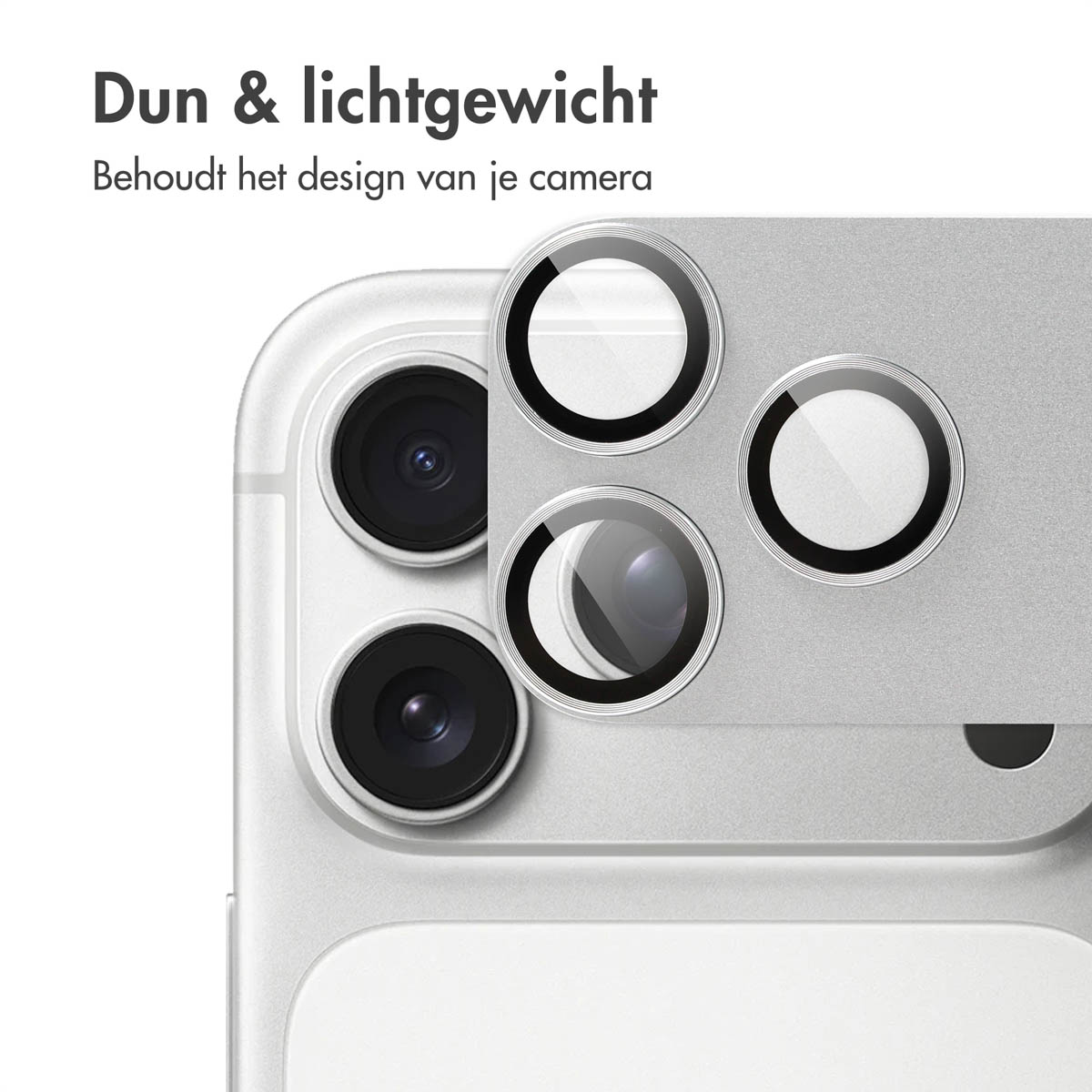 Close-up van een telefooncamera met beschermende lenzen. De telefoon is zilver. De lenzen zijn helder met zwarte ringen.