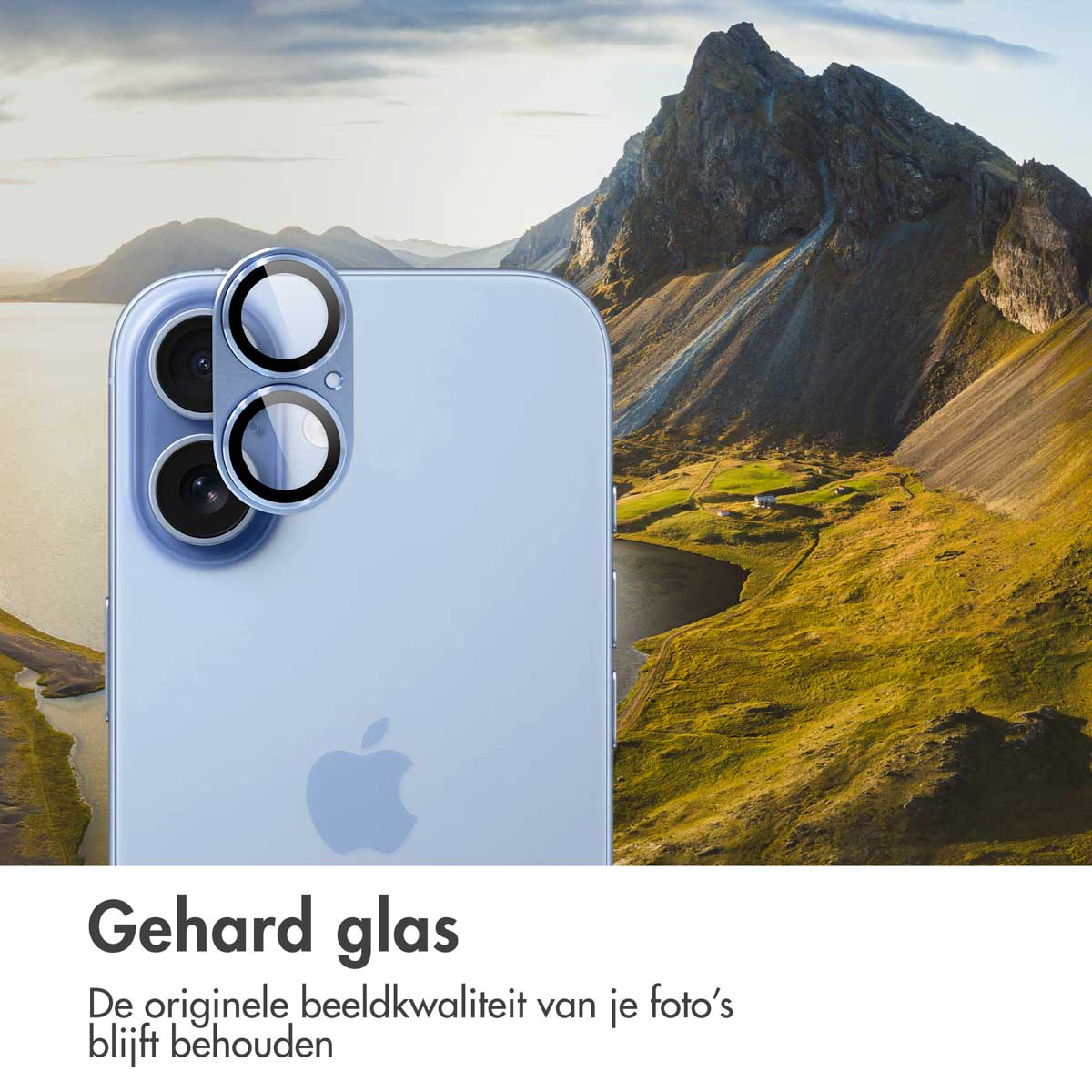A close-up of a light blue phone with three camera lenses. In the background, there's a mountain landscape and a lake.