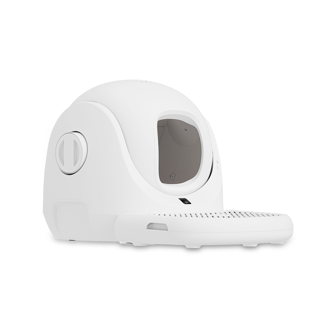 A white, modern cat litter box with a rounded top and a tray at the bottom. The box has an opening on the side.