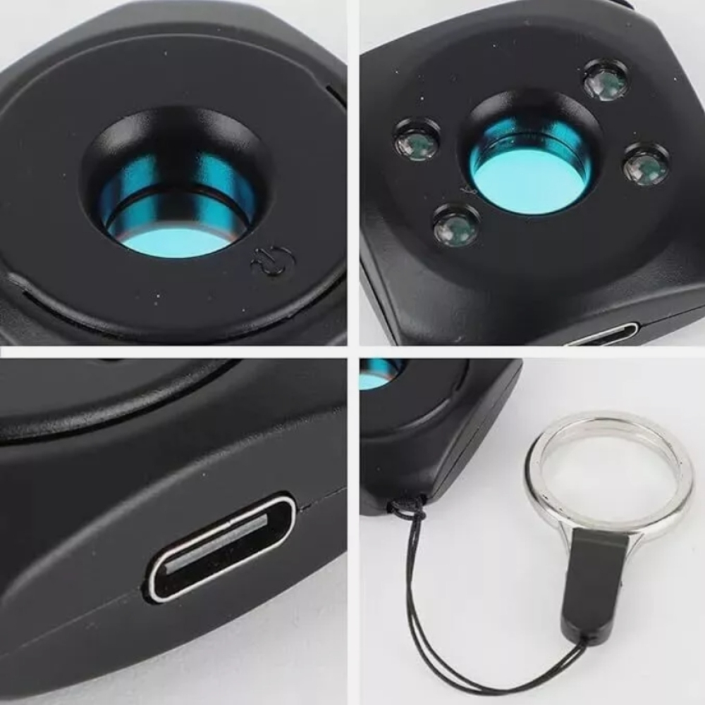 Ein schwarzes Gerät mit blauer Linse, USB-Anschluss und Lupe. Das Gerät hat kleine grüne Lichter.