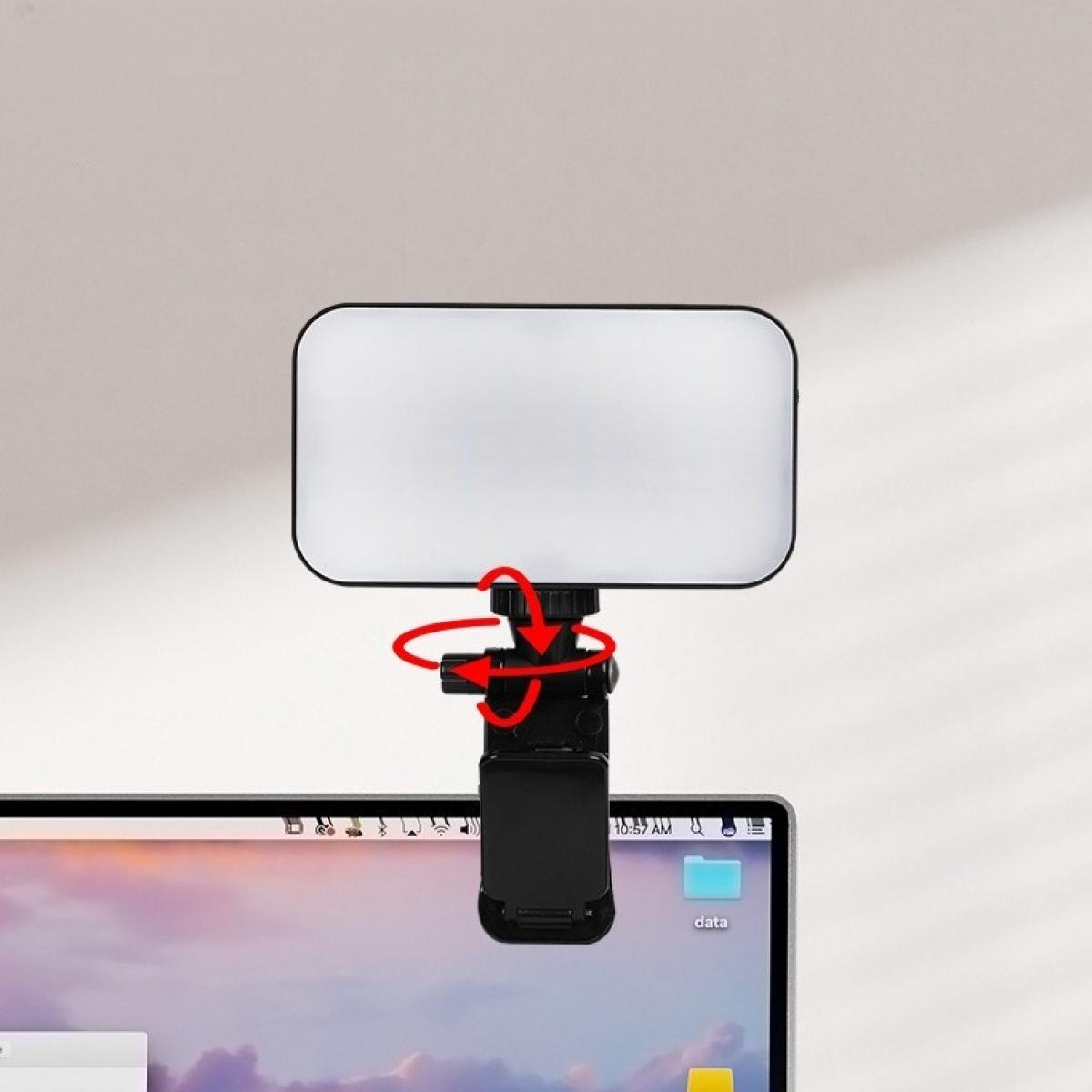 Ein kleines LED-Licht ist an einem Laptop-Bildschirm befestigt. Rote Pfeile zeigen die Einstellpunkte. Der Laptop zeigt einen Desktop.