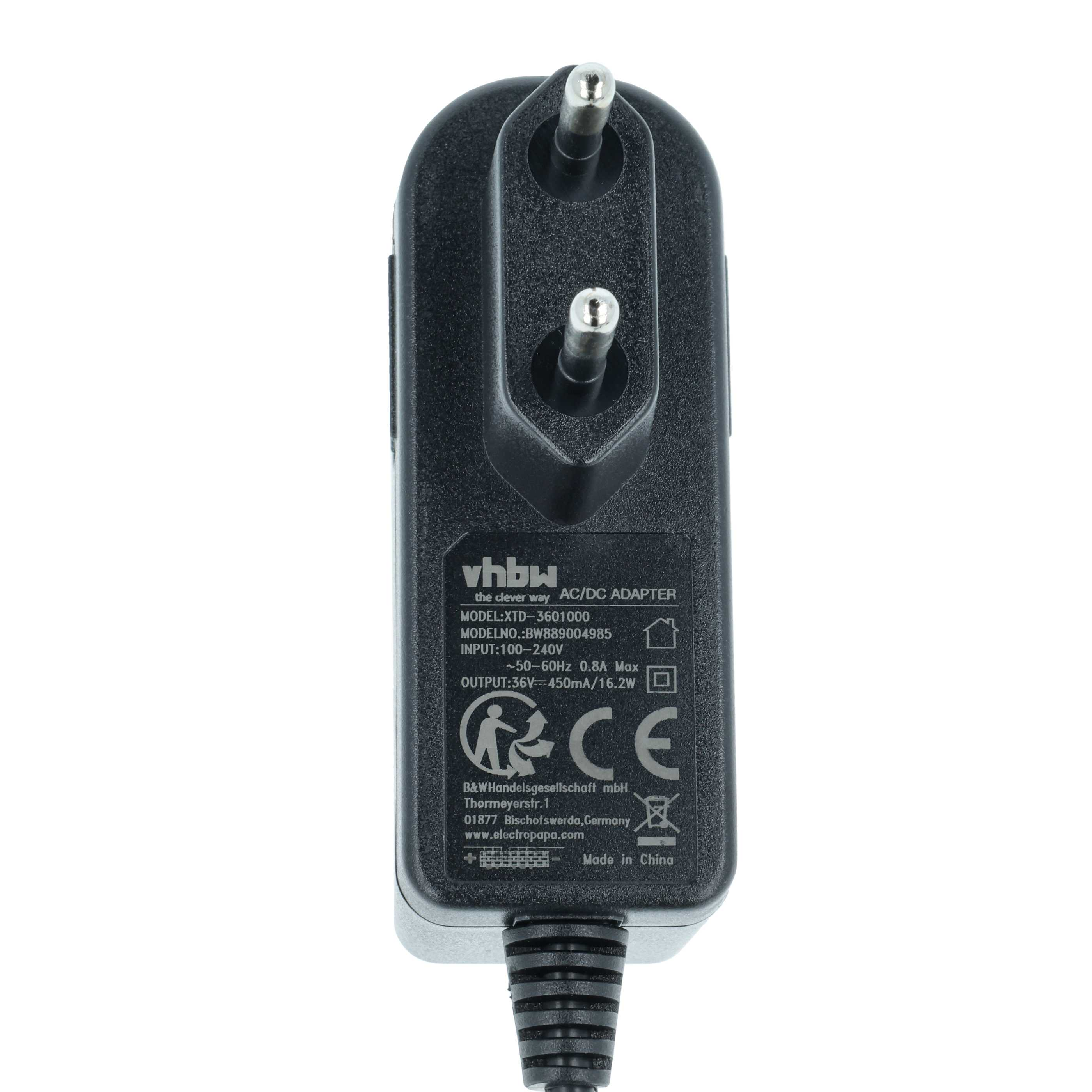 Ein schwarzes AC/DC-Adapter mit zwei Stiften und einem Etikett mit Text. Es hat ein Netzkabel.