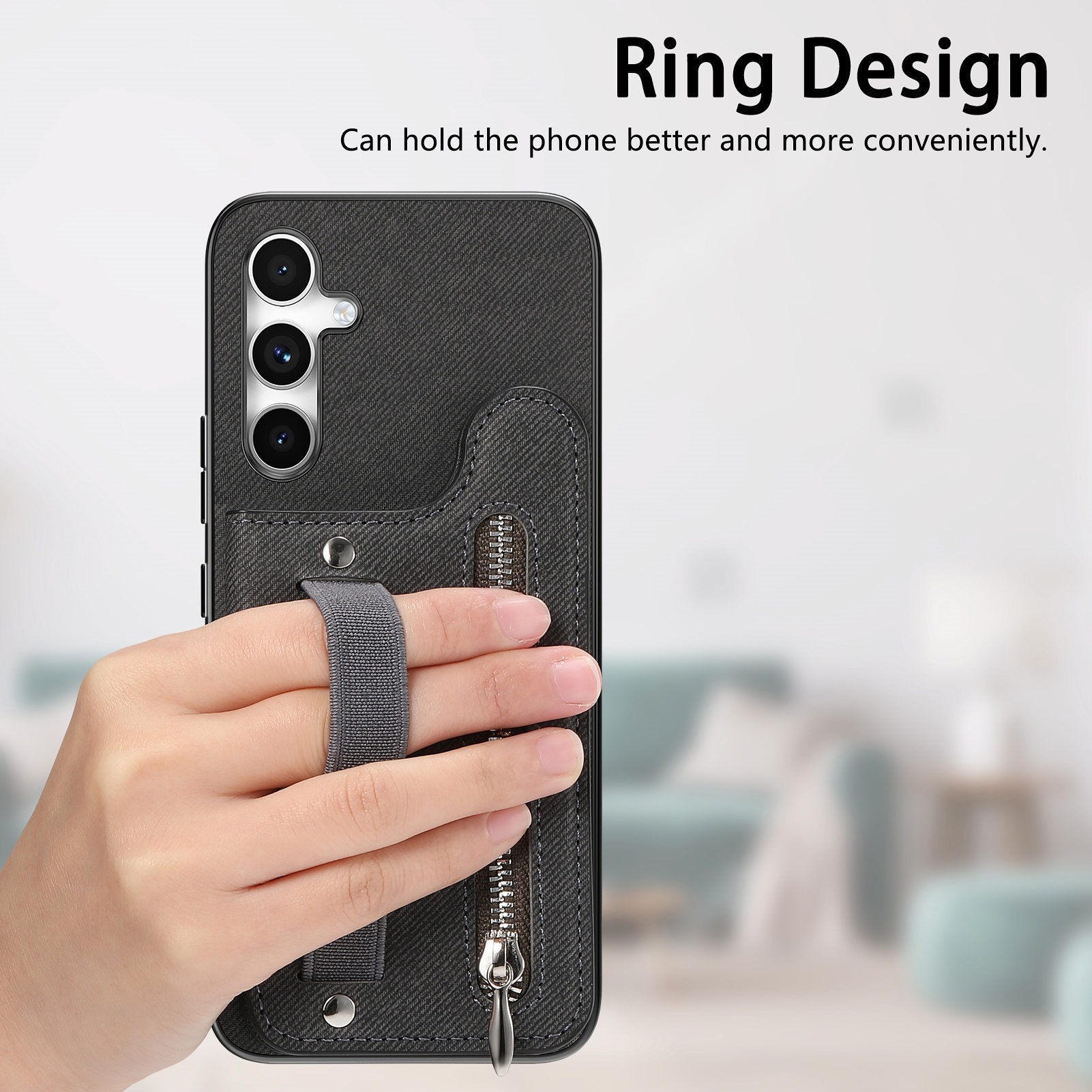 Mano che tiene una custodia per telefono con un anello. La custodia è nera con cerniera e cinturino ad anello.