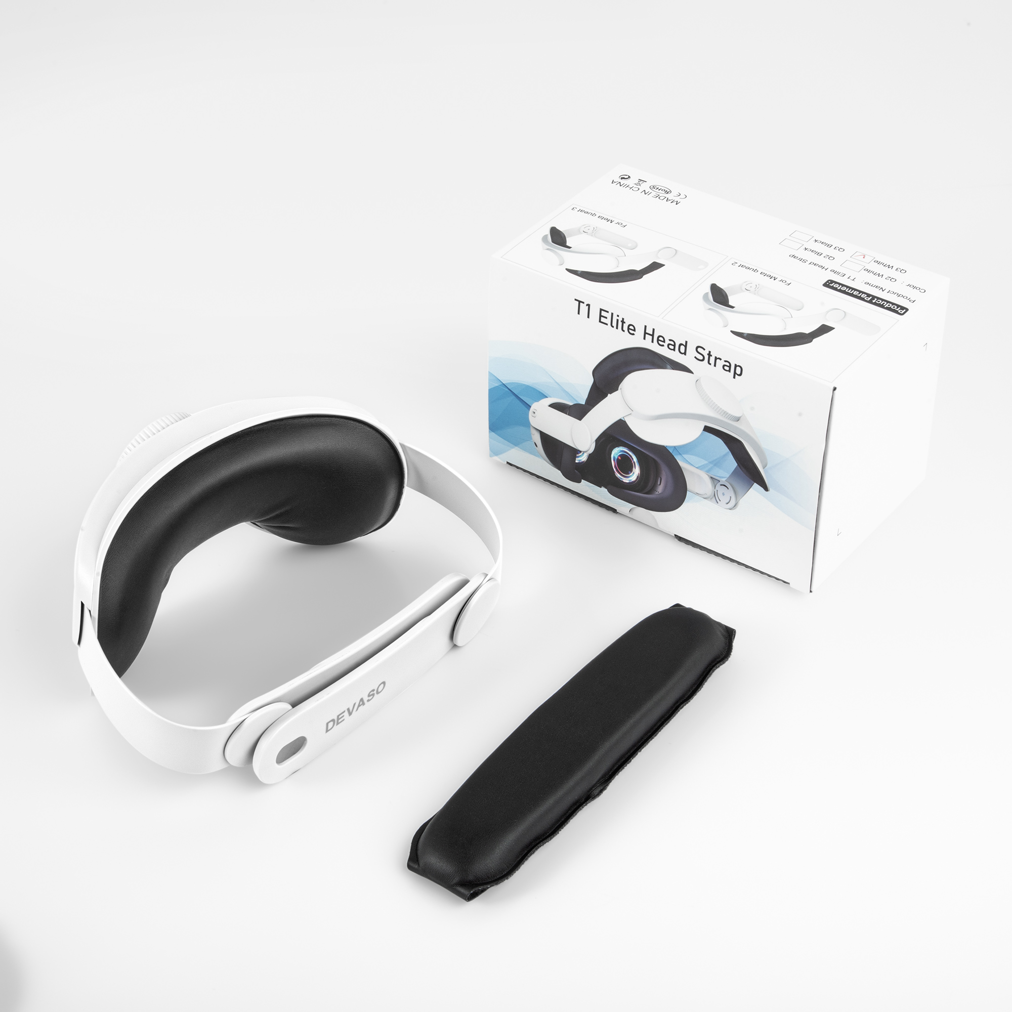 Biało-czarny pasek na głowę T1 Elite, pudełko i osobna czarna podkładka na białym tle. Tekst na pudełku: T1 Elite Head Strap.