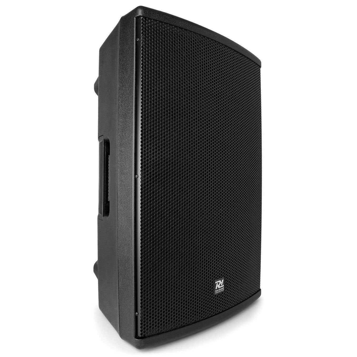 Un altavoz negro rectangular. Tiene una parte delantera perforada y un asa lateral. El altavoz está sobre una superficie blanca.