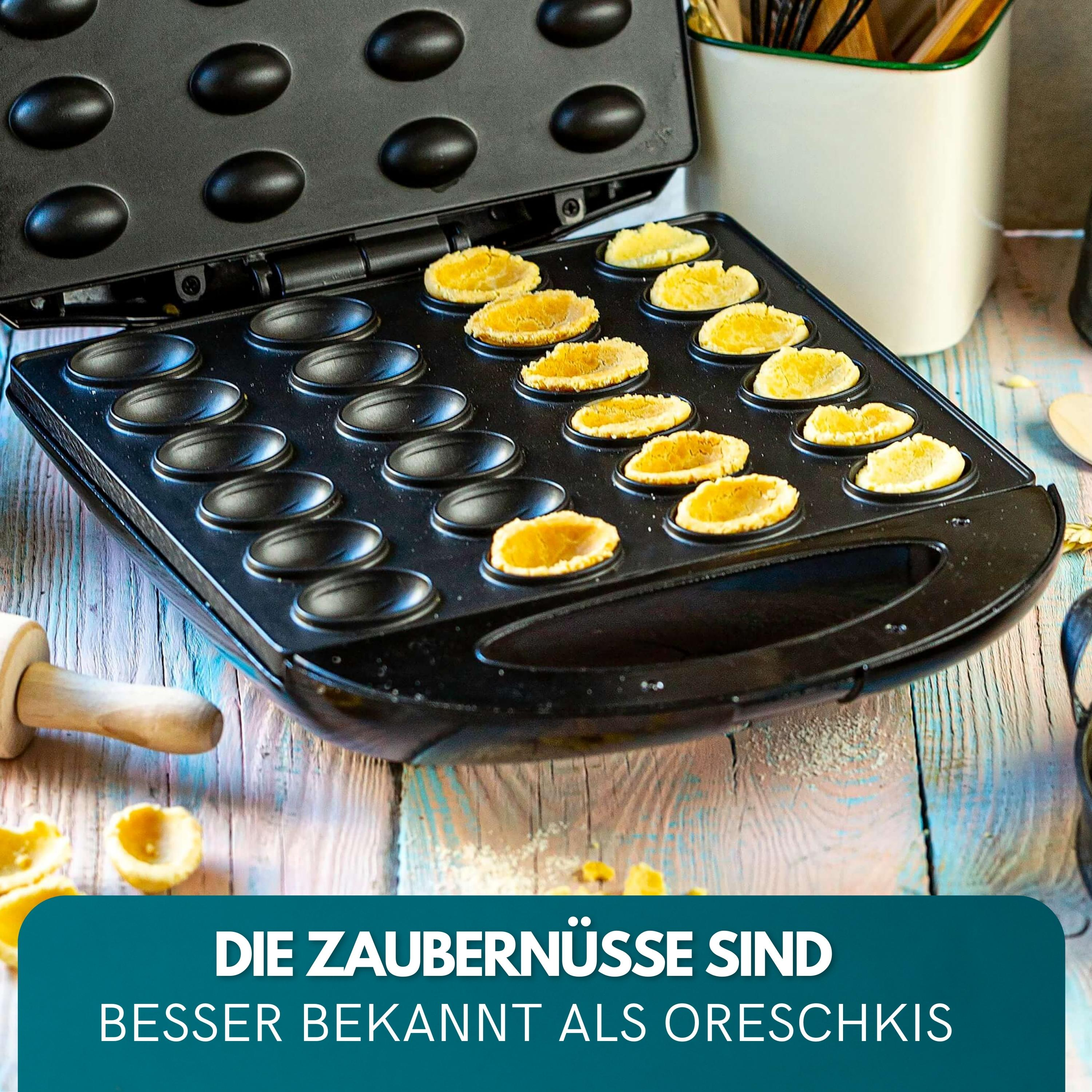 Czarny ekspres do oreshki z upieczonymi ciasteczkami. Wałek do ciasta i biały pojemnik w tle.