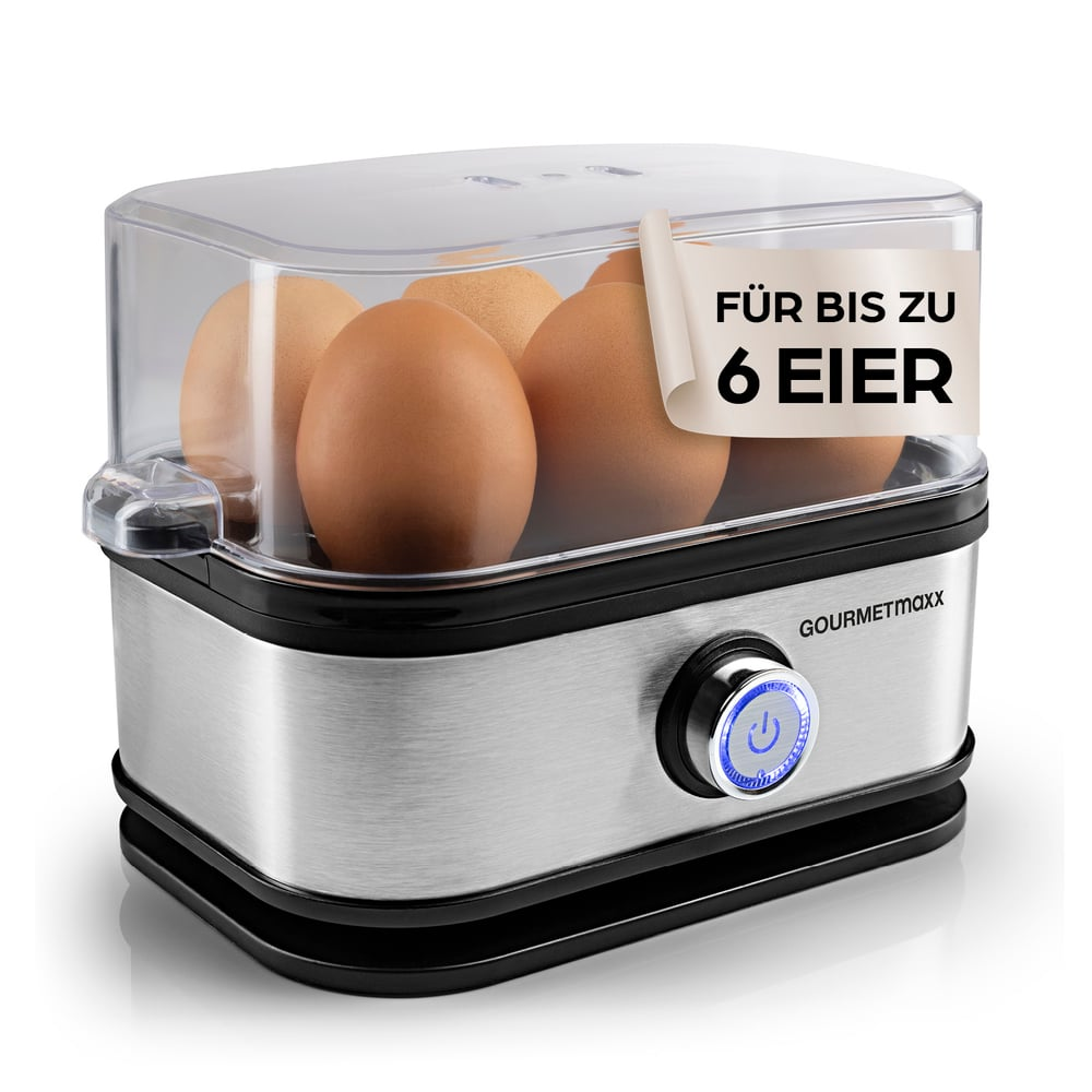 Ein Eierkocher mit sechs braunen Eiern. Er ist aus Edelstahl mit schwarzem Sockel und durchsichtigem Deckel.
