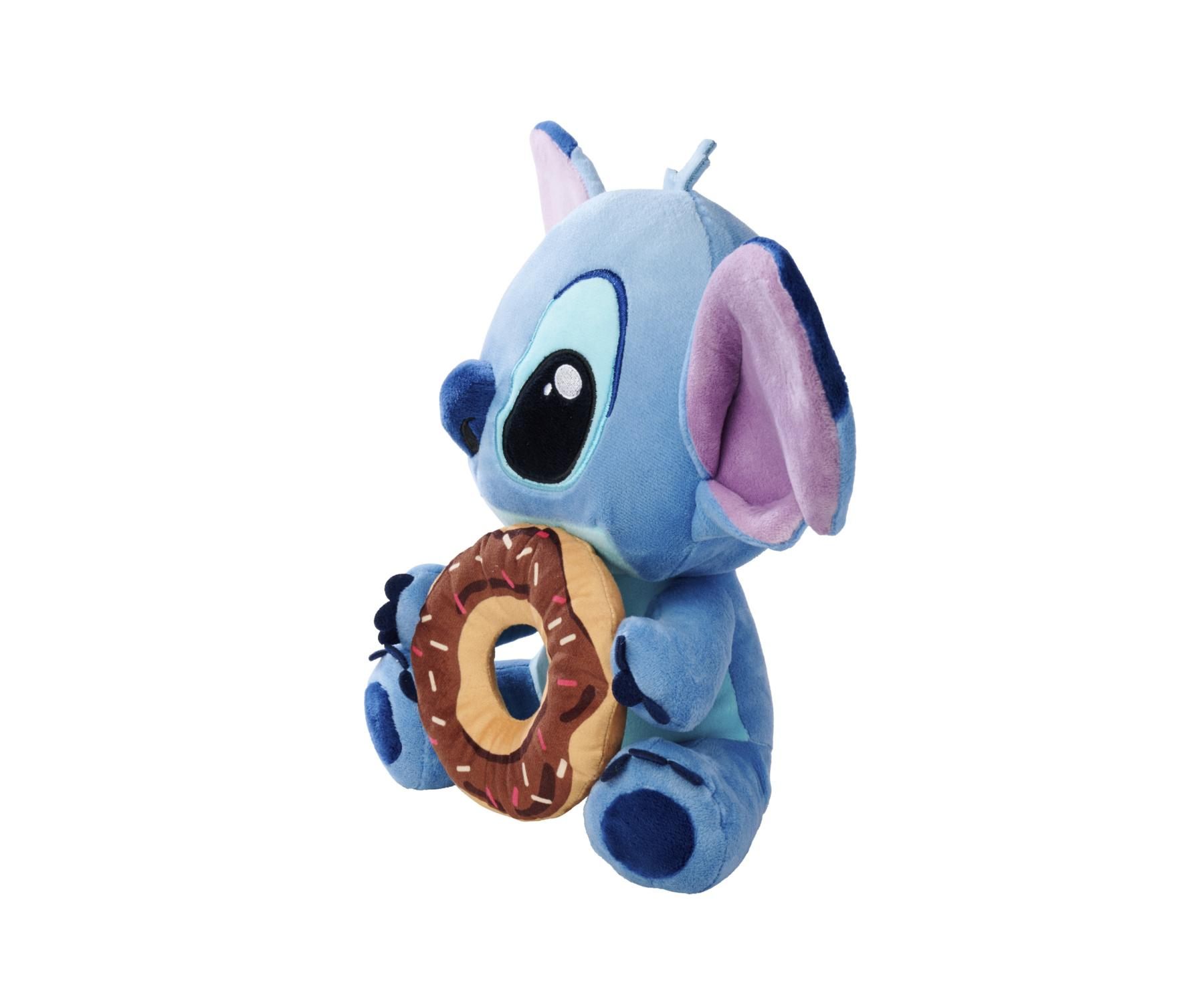 Ein blaues Stitch-Plüschtier hält einen Donut. Der Donut ist braun mit Streuseln. Stitch hat große Augen und Ohren.