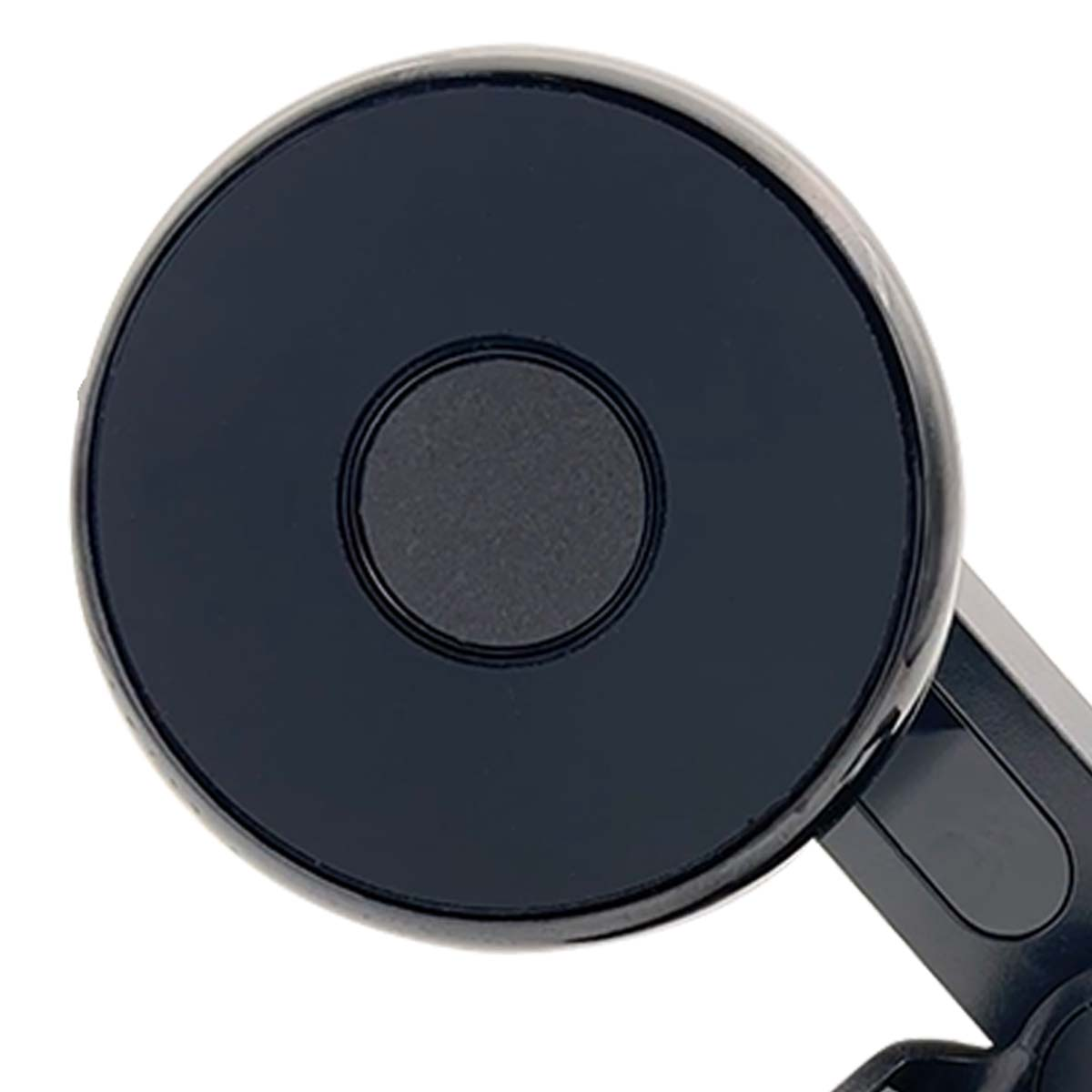 Primer plano de un objeto circular negro, posiblemente un soporte para teléfono de coche. Tiene un círculo más pequeño y oscuro en el centro.