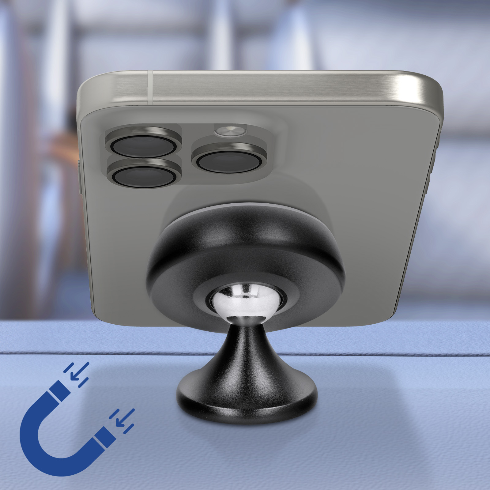 Ein Telefon, das an einem schwarzen magnetischen Telefonhalter befestigt ist. Das Telefon ist silberfarben. Der Hintergrund ist blau verschwommen.