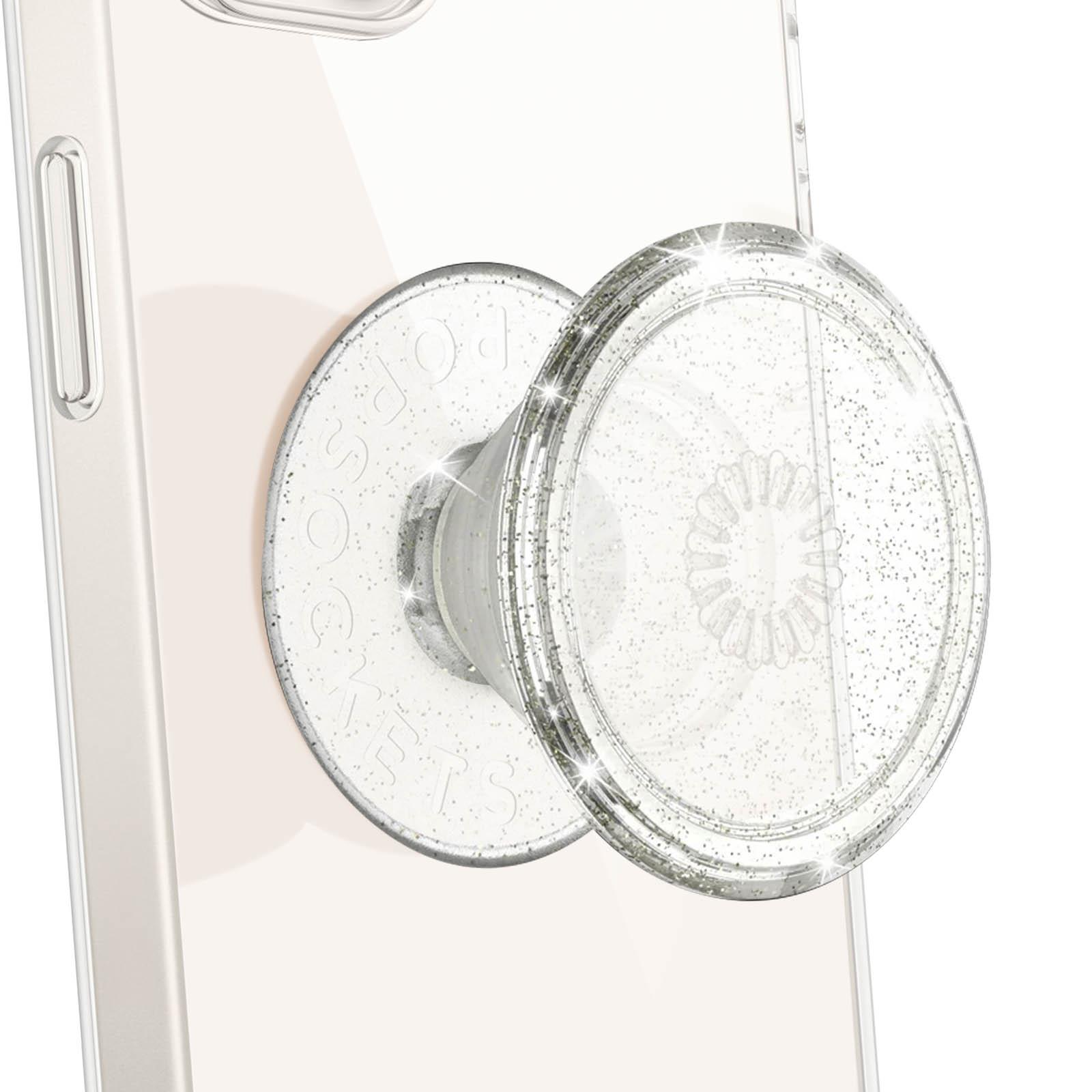 Primo piano di un'impugnatura trasparente per telefono con glitter argentati su un telefono. L'impugnatura è circolare.