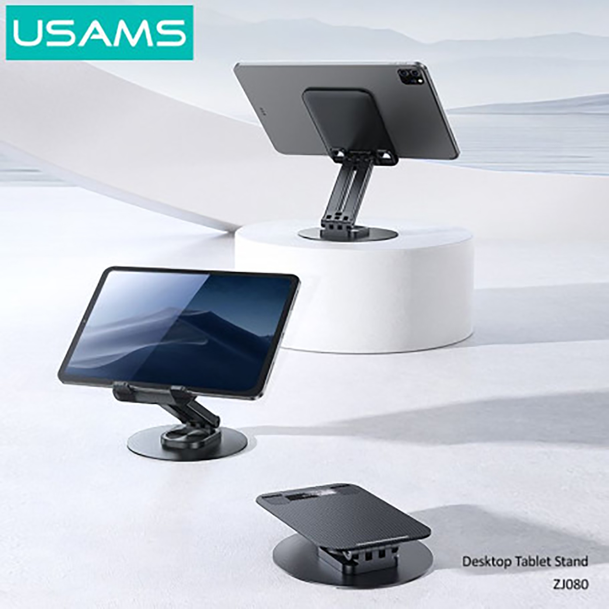 Tablet su supporti. Tablet neri su supporti neri di diversi design. Logo USAMS in alto a sinistra.