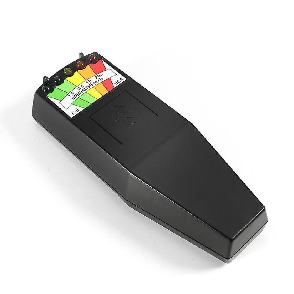Ein schwarzes K-II EMF-Messgerät liegt auf einer weißen Oberfläche. Es hat eine farbige Lichtanzeige und eine Skala für Milligauss-Messwerte.
