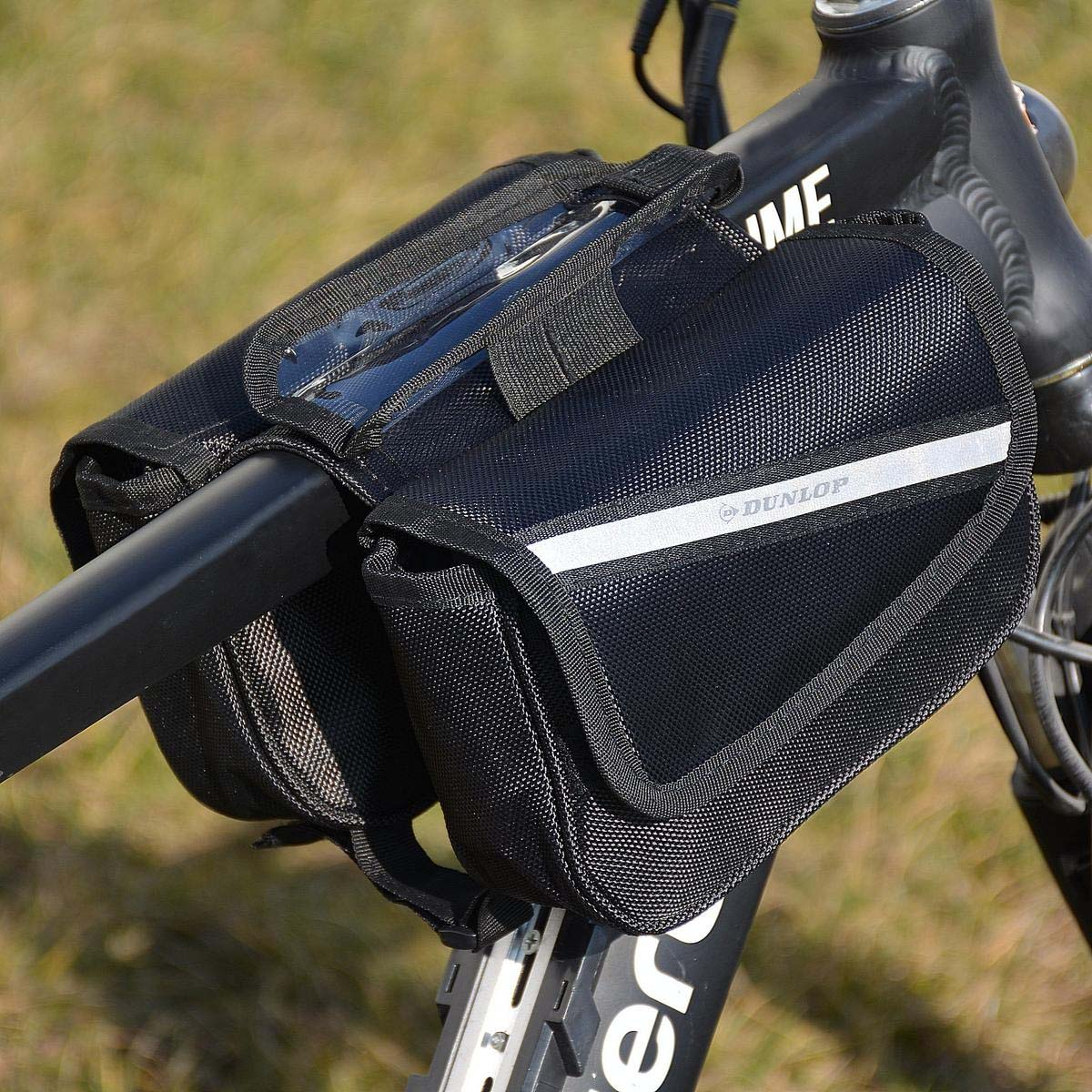 Schwarze Fahrradtasche mit reflektierendem Streifen und Dunlop-Logo, am Lenker befestigt. Eine transparente Handyhalterung ist sichtbar.