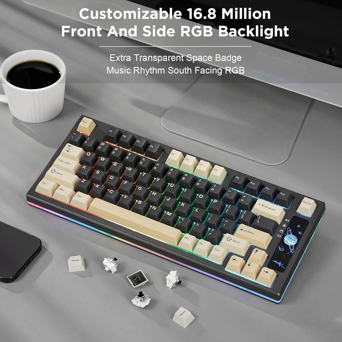 A keyboard with RGB backlight, keycaps, and a cup of coffee are on a desk. Some keycaps are loose. The keyboard is black.