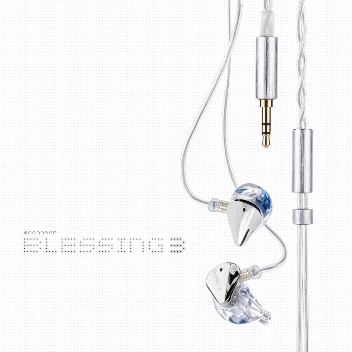 Oortelefoons met transparante en zilveren componenten. De merknaam 'MOONDROP BLESSINGS 3' staat links. Witte achtergrond.